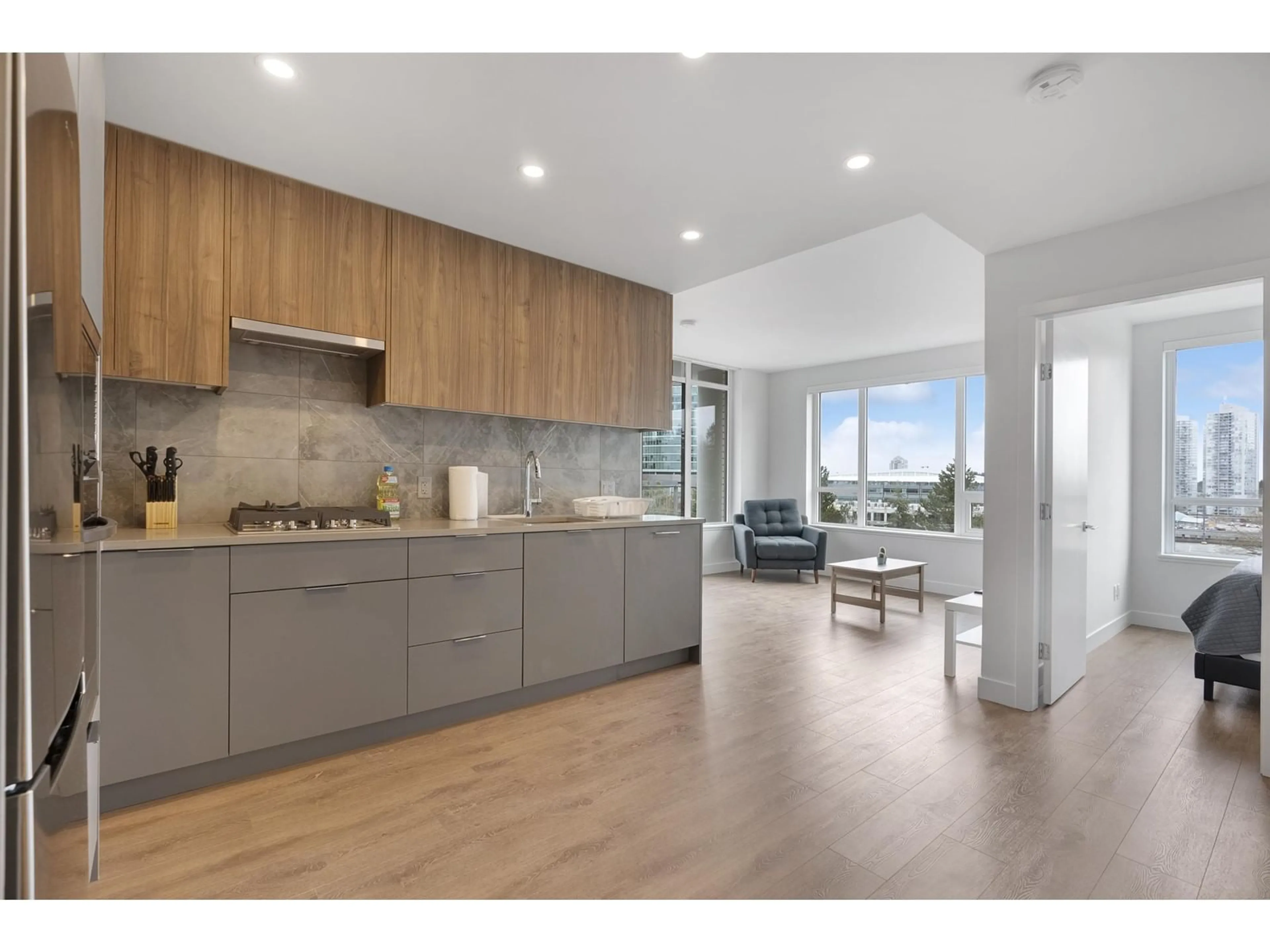 Open concept kitchen, wood/laminate floor for 302 - 13359 OLD YALE, Surrey British Columbia V3T0S4