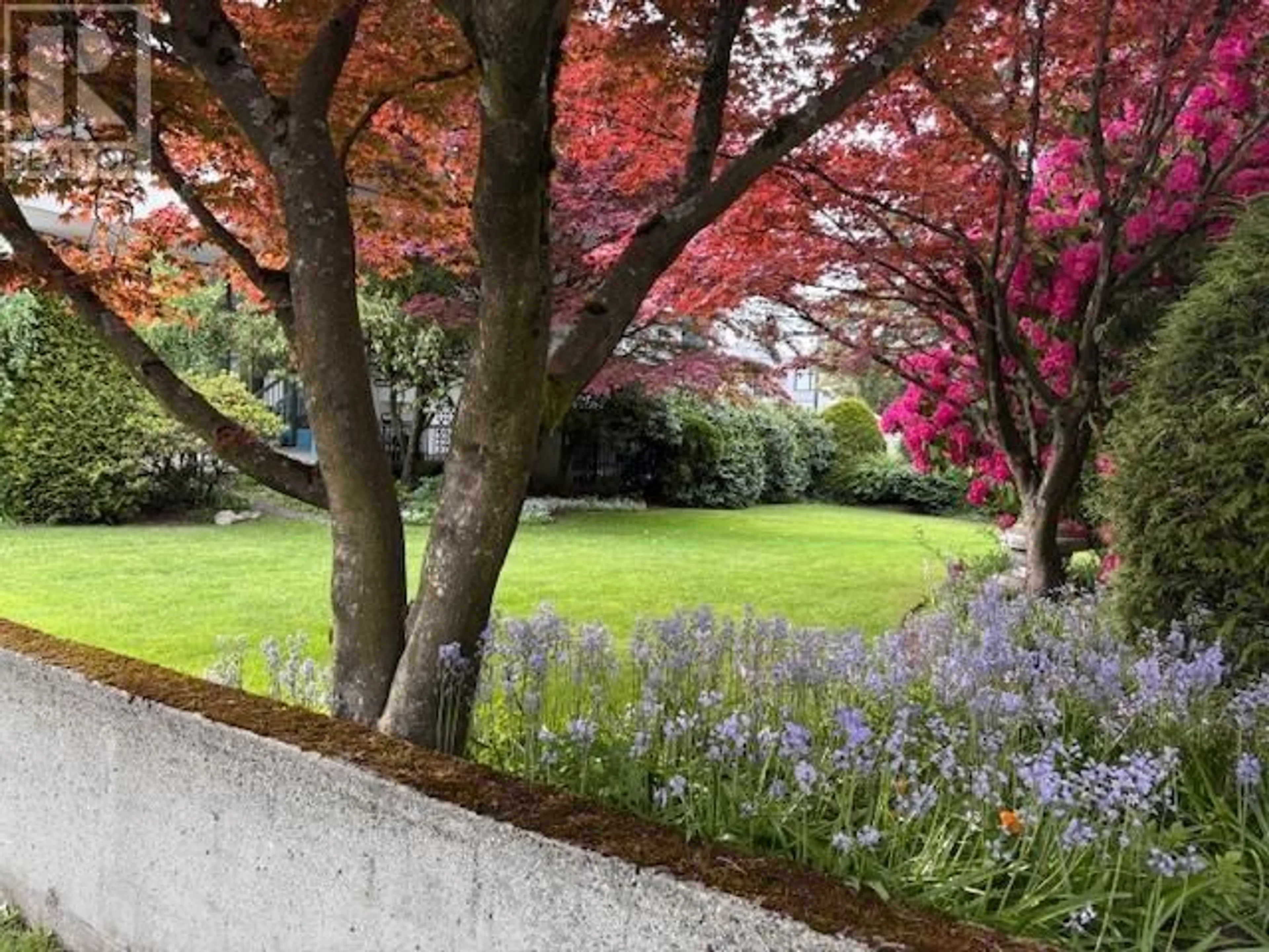 A pic from outside/outdoor area/front of a property/back of a property/a pic from drone, forest/trees view for 203 - 4691 10 AVENUE, Vancouver British Columbia V6R2J3