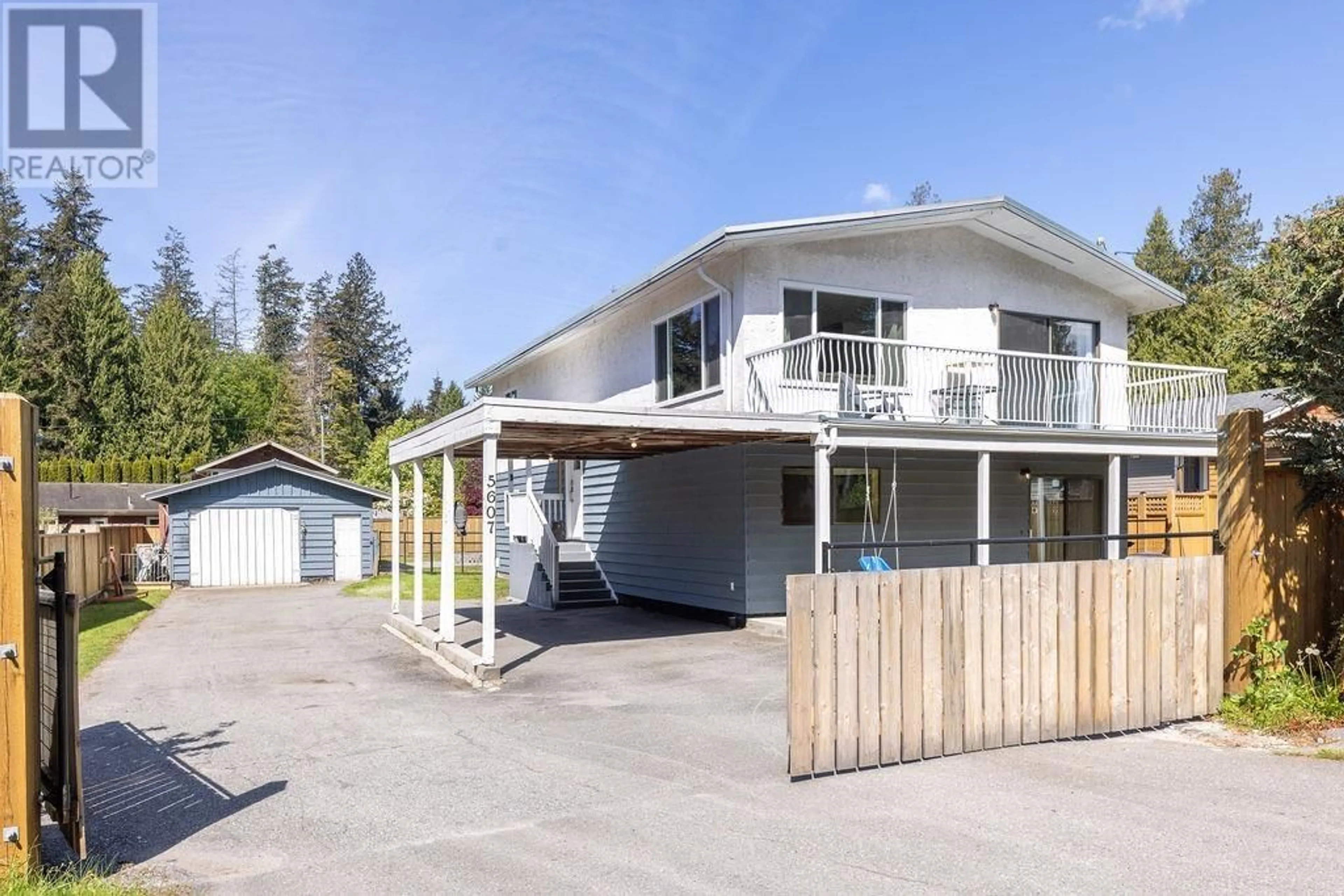 A pic from outside/outdoor area/front of a property/back of a property/a pic from drone, street for 5607 WAKEFIELD ROAD, Sechelt British Columbia V7Z0N3