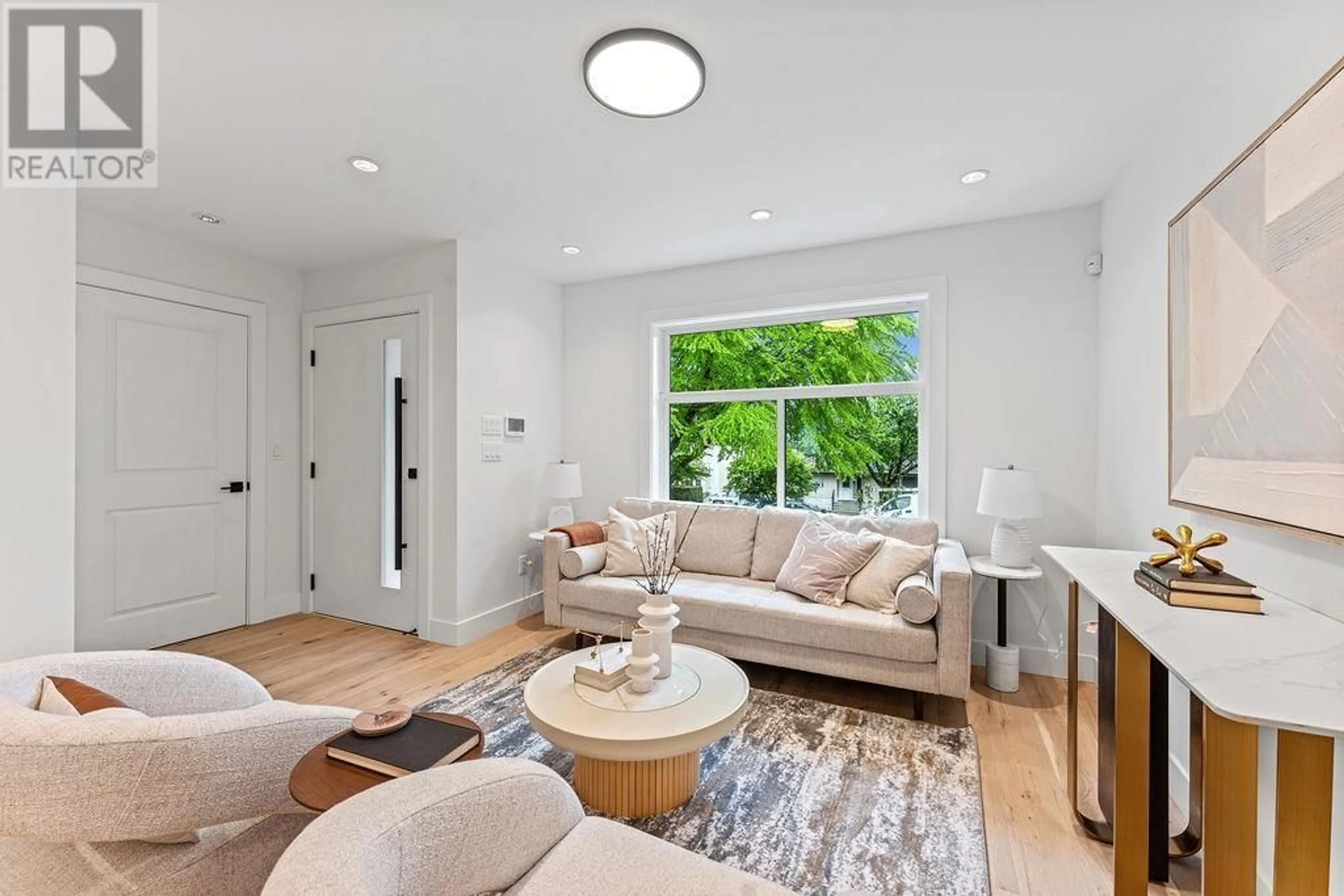 Living room with furniture, unknown for 4917 VENABLES STREET, Burnaby British Columbia V5B1X8