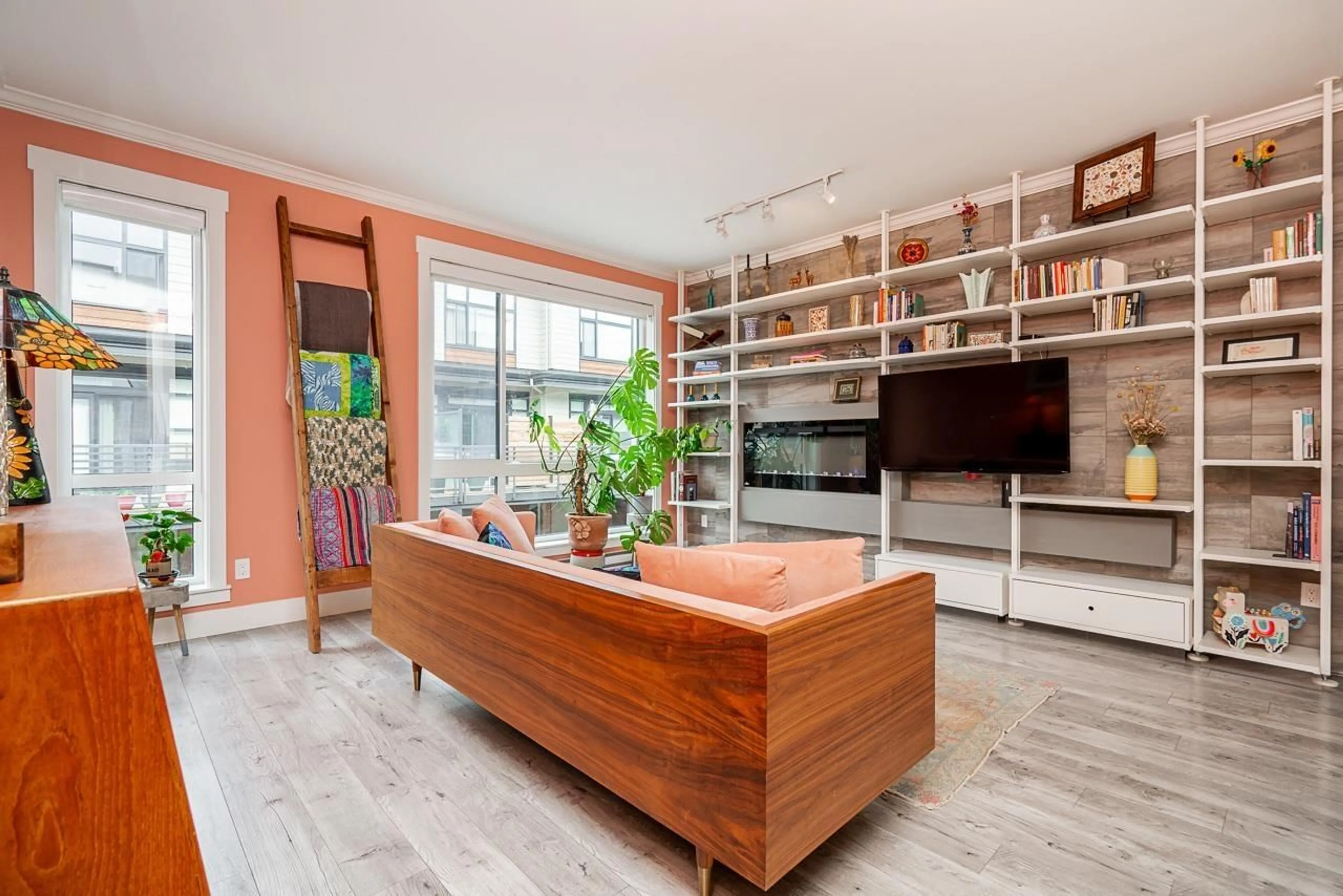 Living room with furniture, wood/laminate floor for 67 - 16488 64, Surrey British Columbia V3S6X6