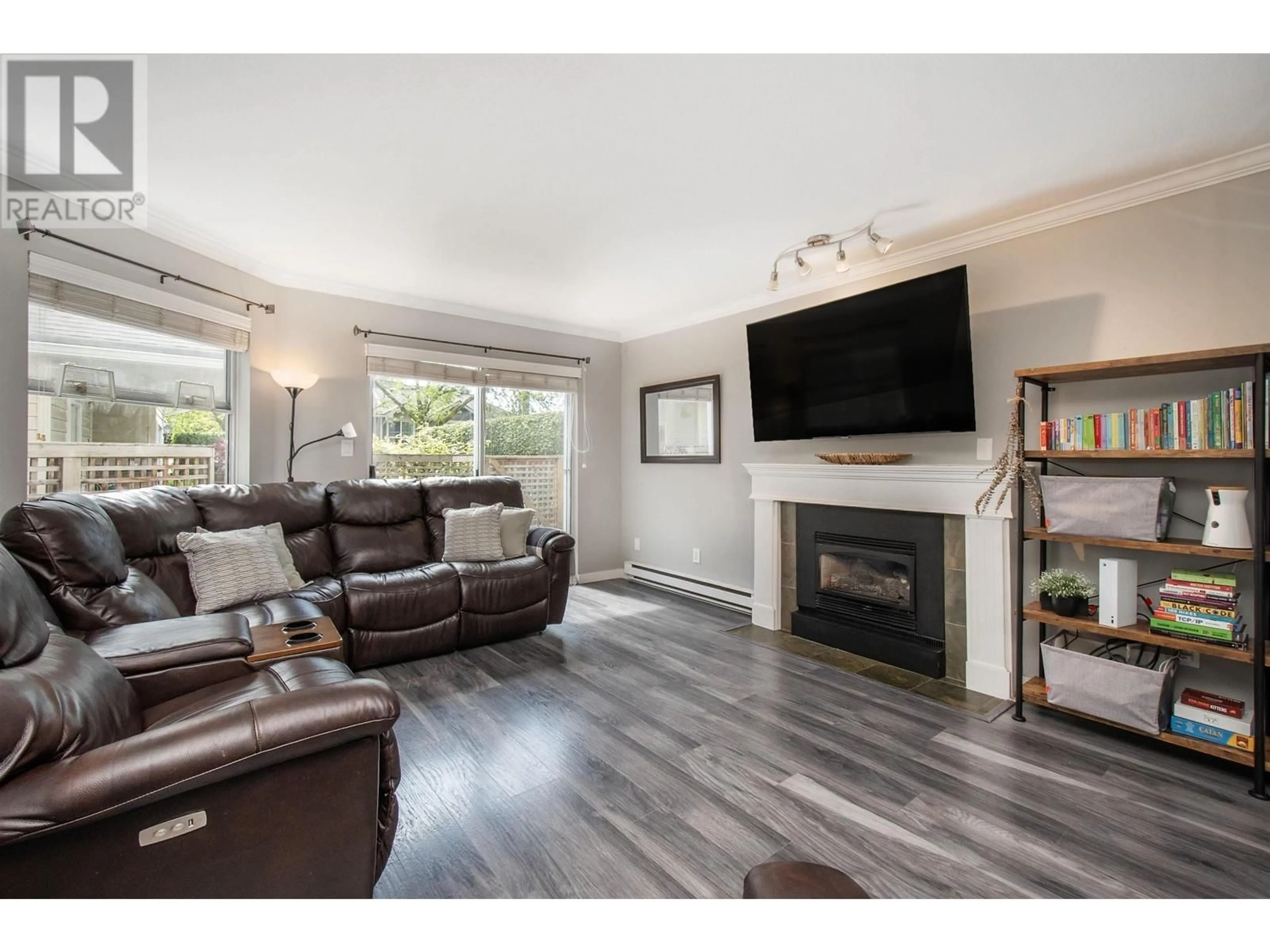 Living room with furniture, wood/laminate floor for 20 - 838 TOBRUCK AVENUE, North Vancouver British Columbia V7P1V9