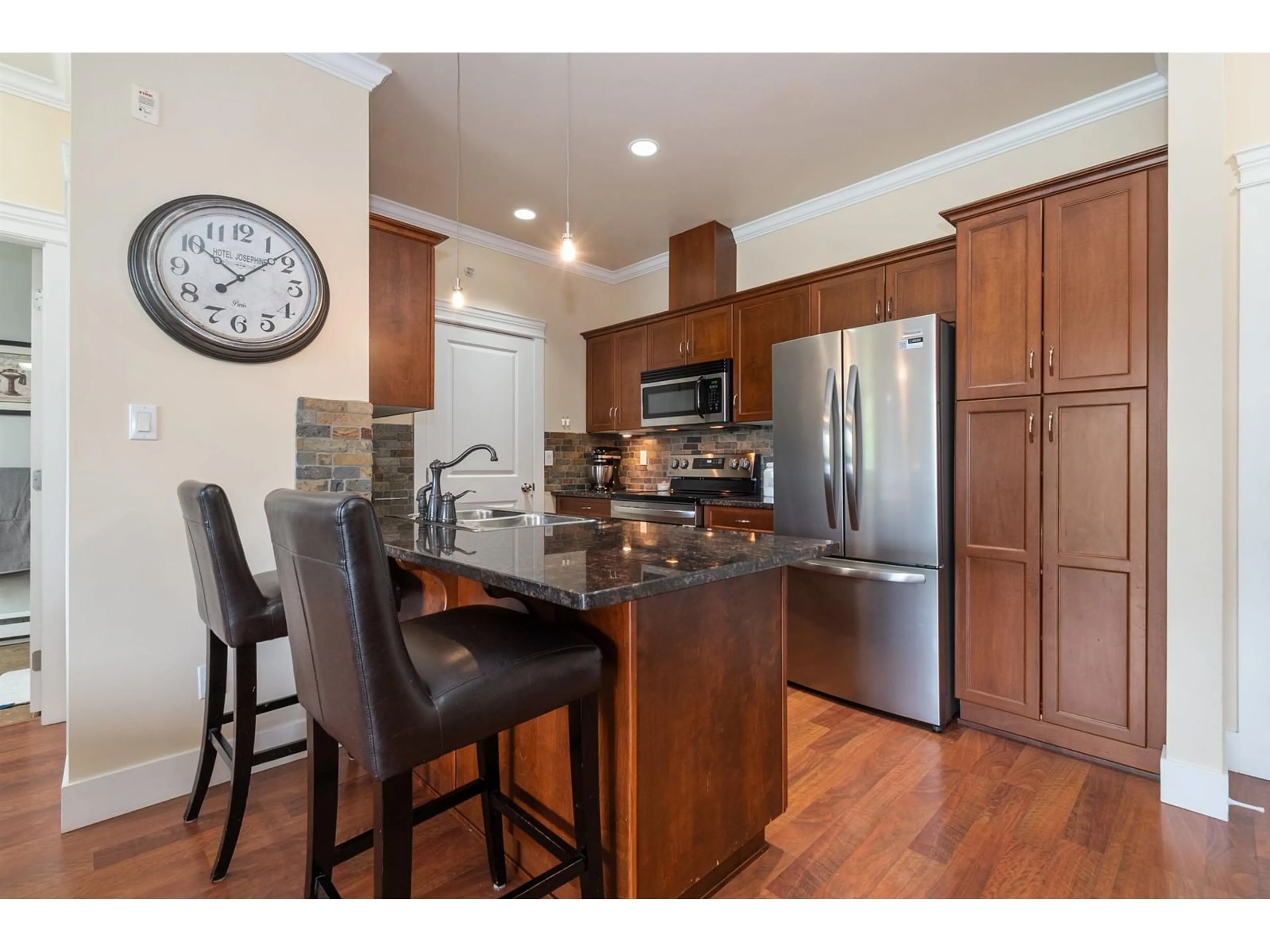 Open concept kitchen, wood/laminate floor for 410 - 2068 SANDALWOOD, Abbotsford British Columbia V2S3H6