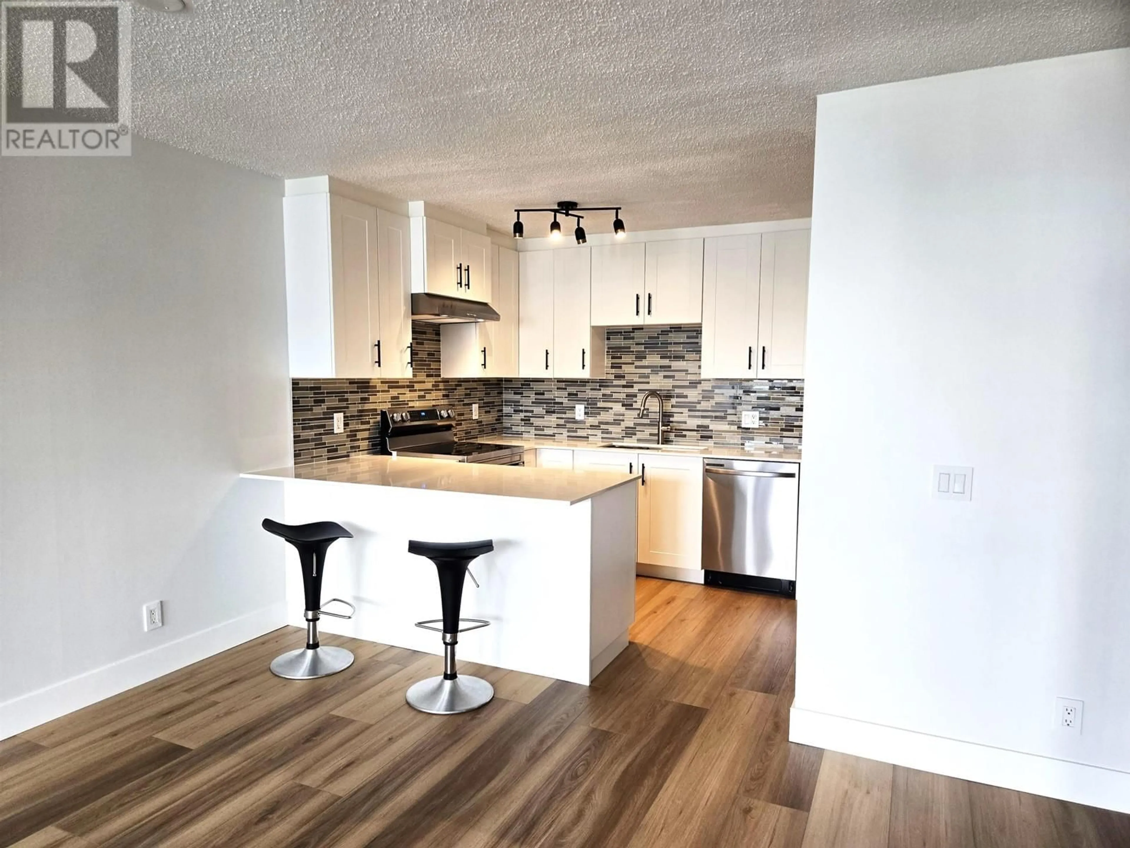 Open concept kitchen, wood/laminate floor for 2304 - 3980 CARRIGAN COURT, Burnaby British Columbia V3N4S6