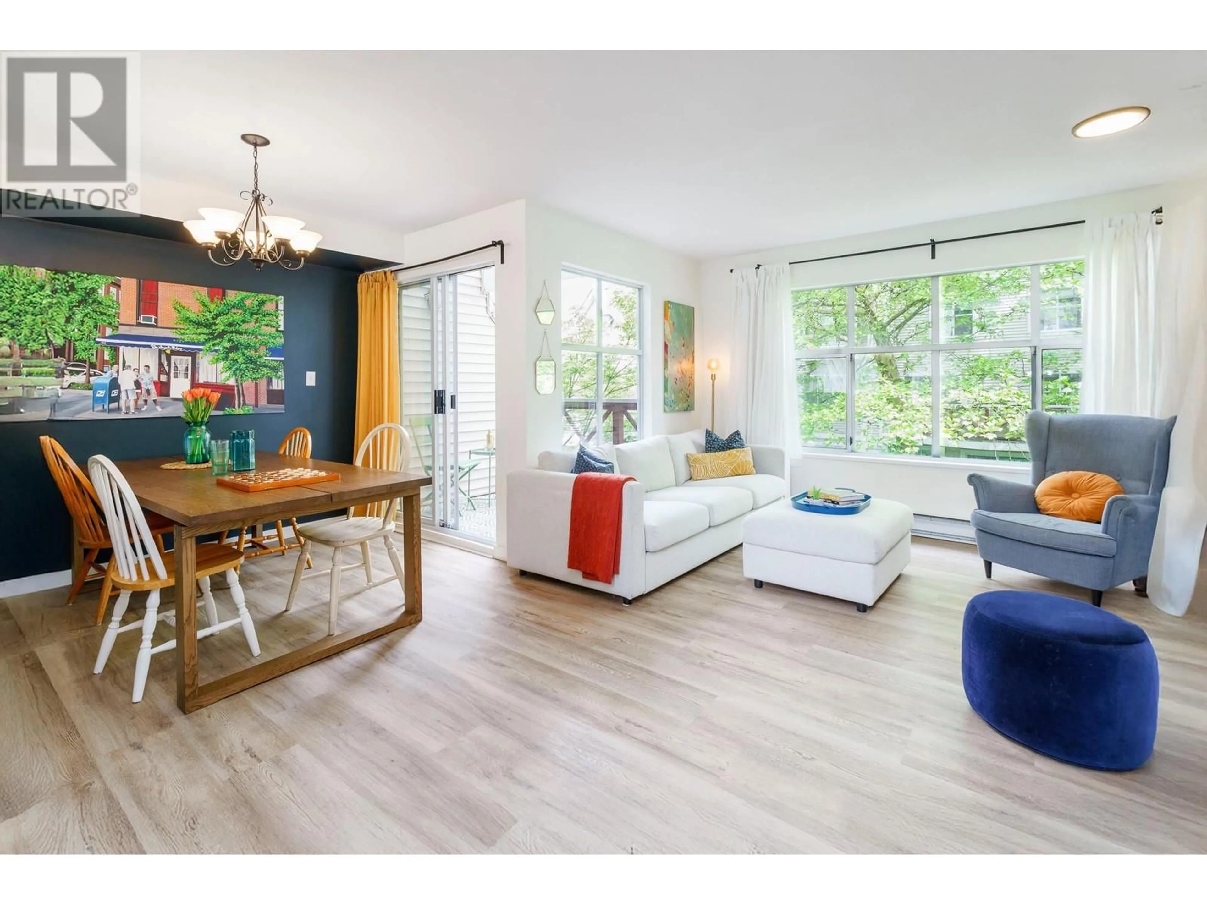 Living room with furniture, wood/laminate floor for 101 - 2450 HAWTHORNE AVENUE, Port Coquitlam British Columbia V3C6B3