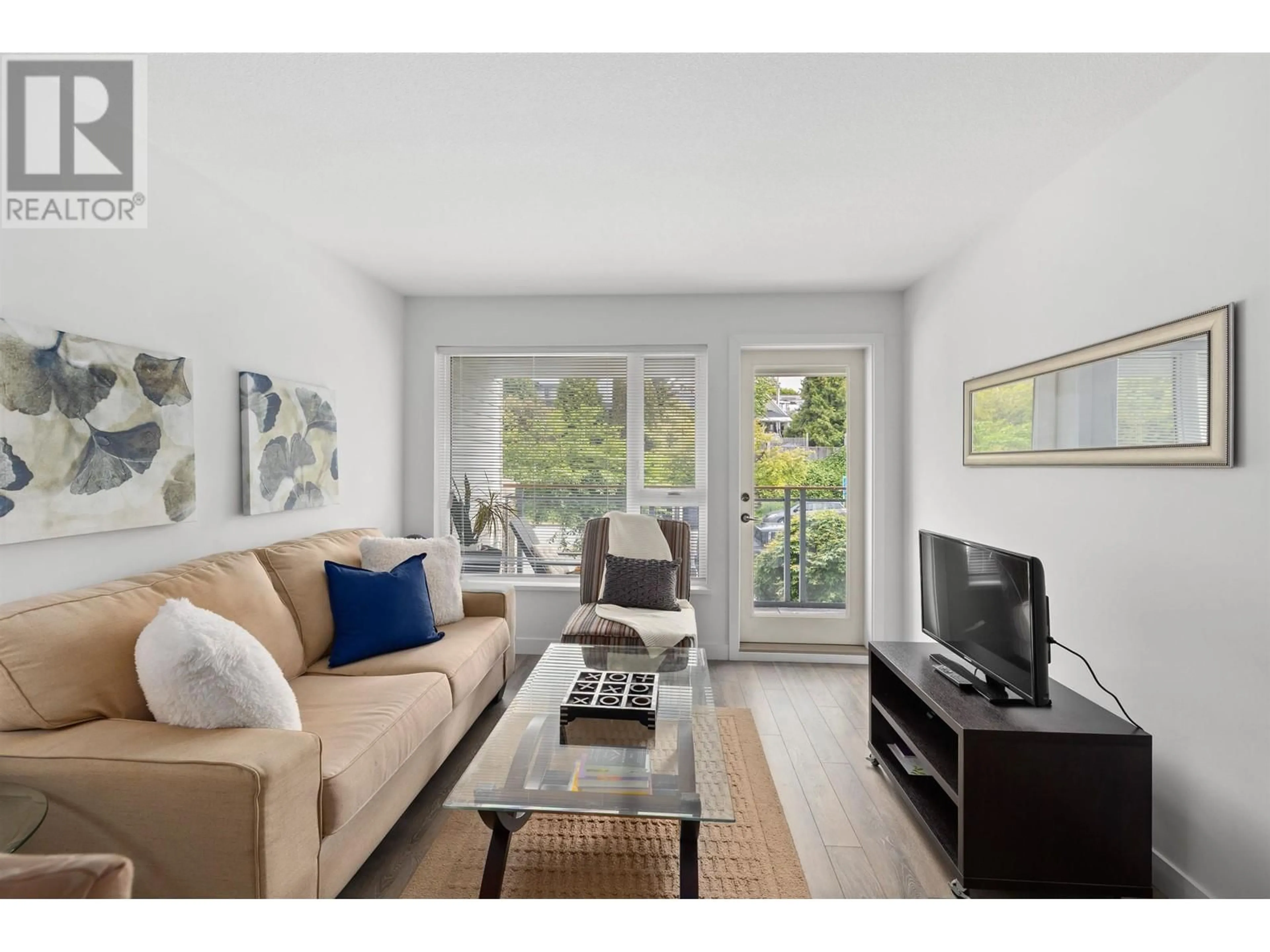 Living room with furniture, wood/laminate floor for 213 - 221 3RD STREET, North Vancouver British Columbia V7L0C1