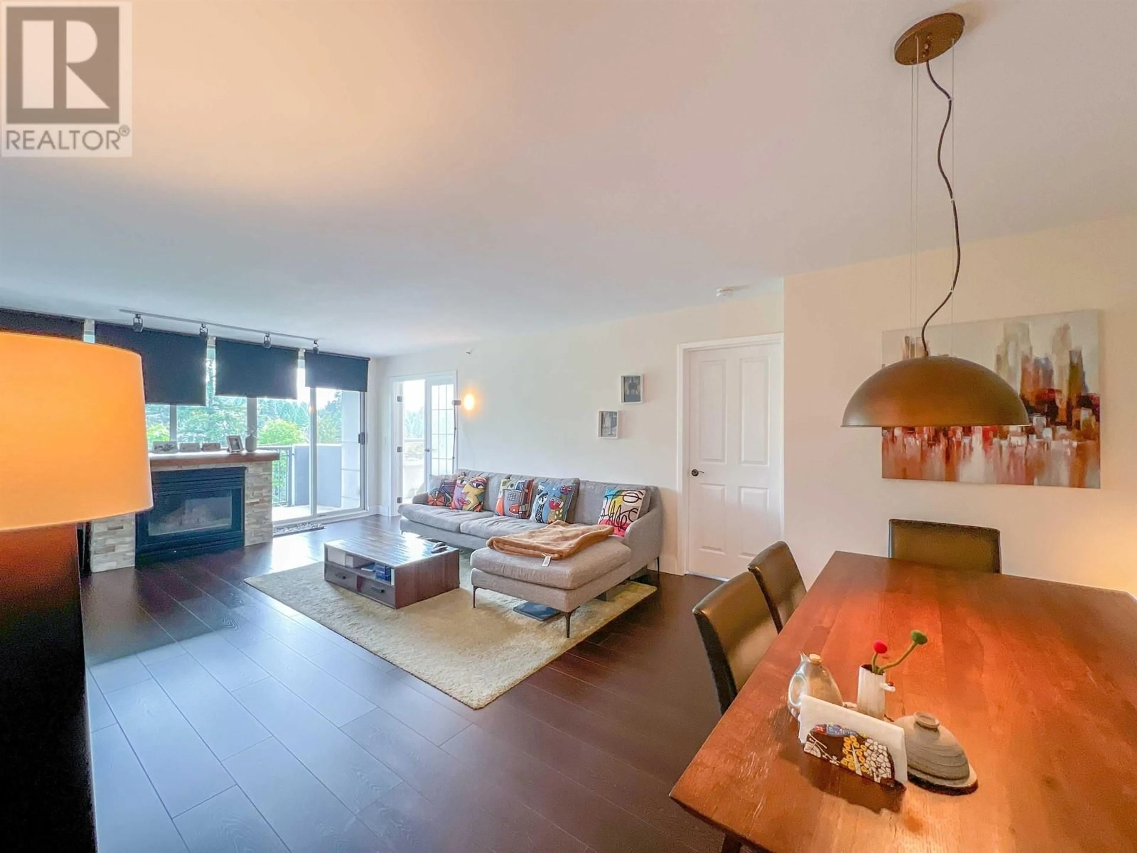 Living room with furniture, wood/laminate floor for 904 - 555 AUSTIN AVENUE, Coquitlam British Columbia V3K6R8