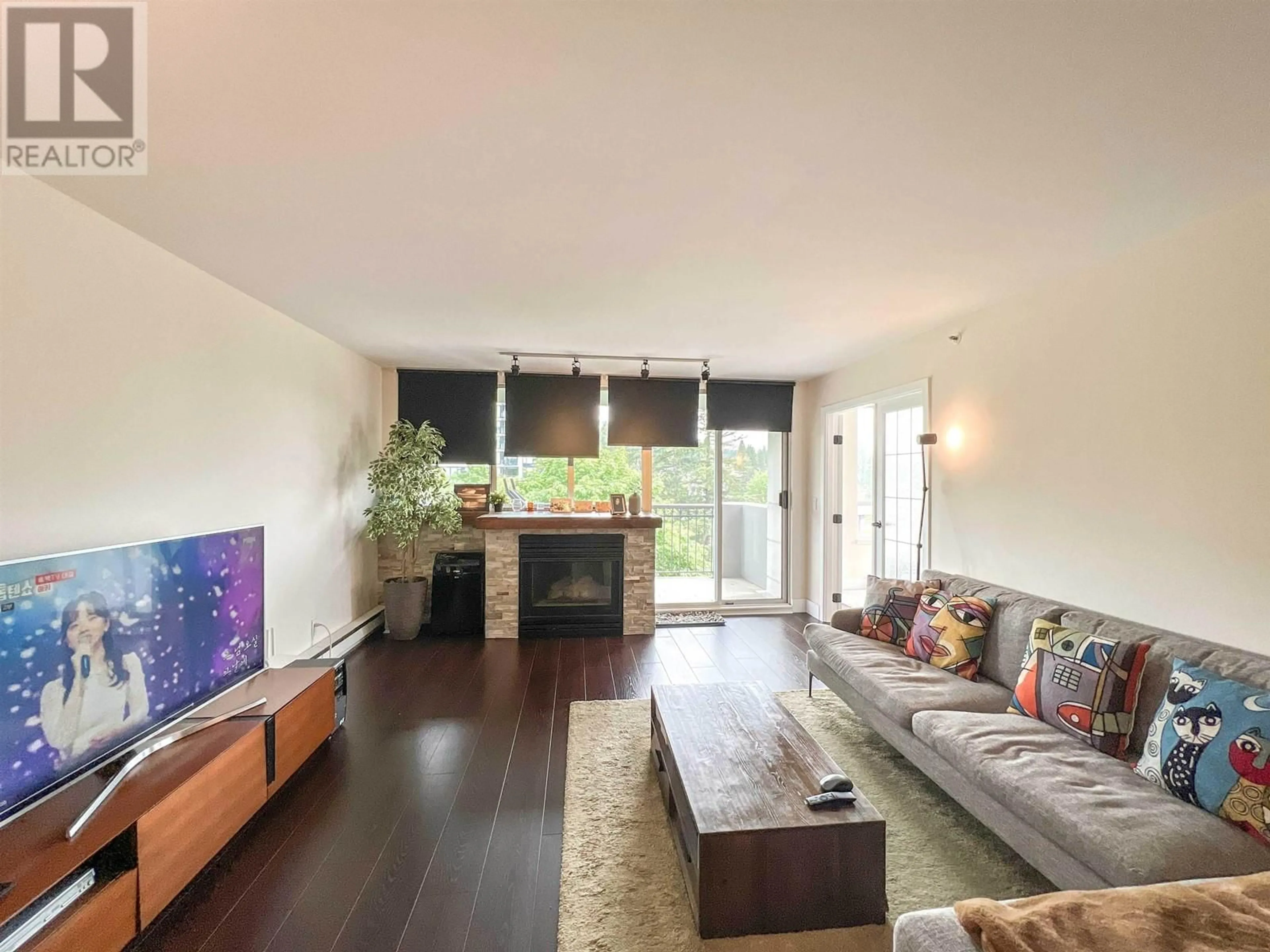 Living room with furniture, wood/laminate floor for 904 - 555 AUSTIN AVENUE, Coquitlam British Columbia V3K6R8