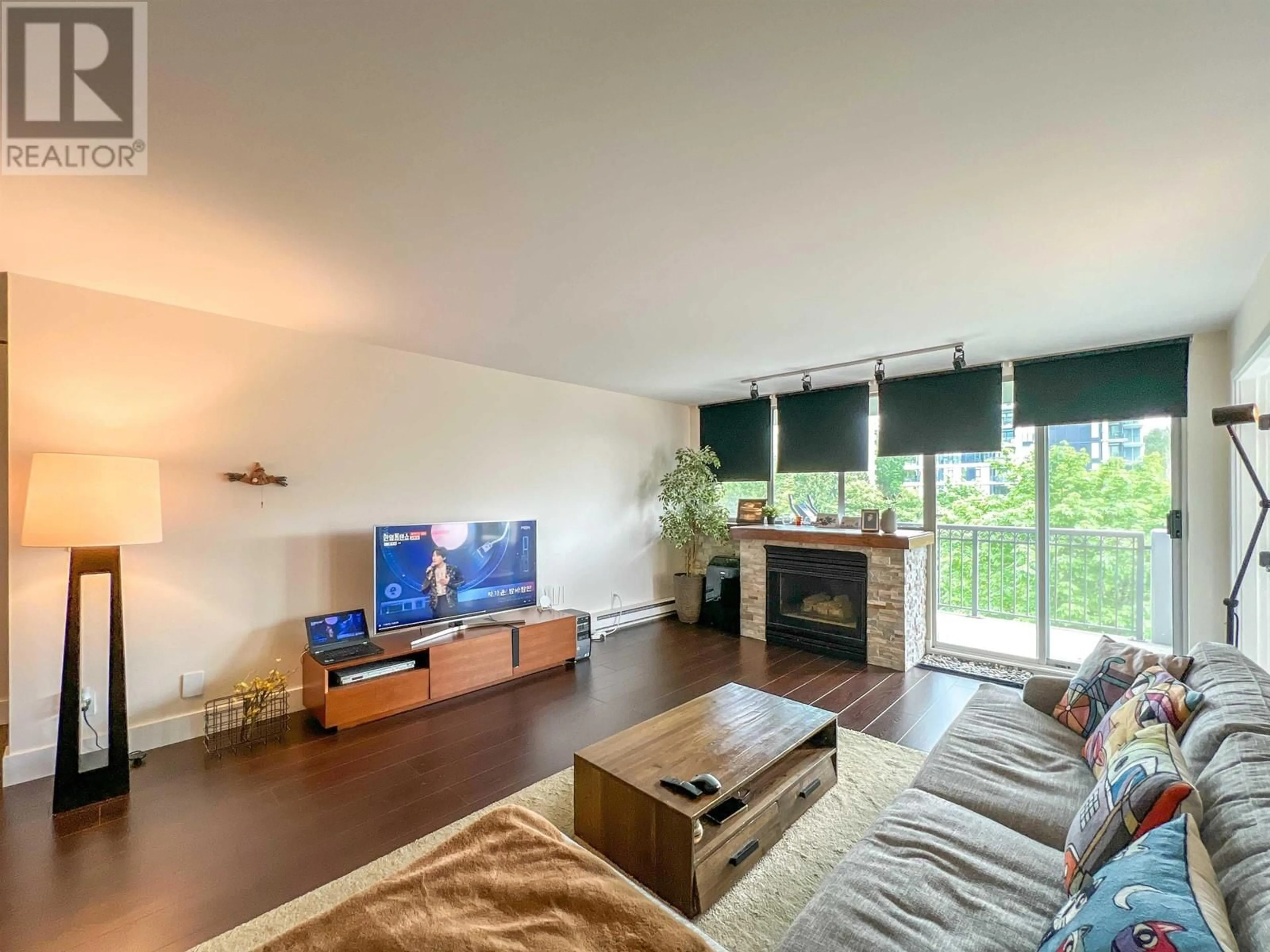 Living room with furniture, wood/laminate floor for 904 - 555 AUSTIN AVENUE, Coquitlam British Columbia V3K6R8