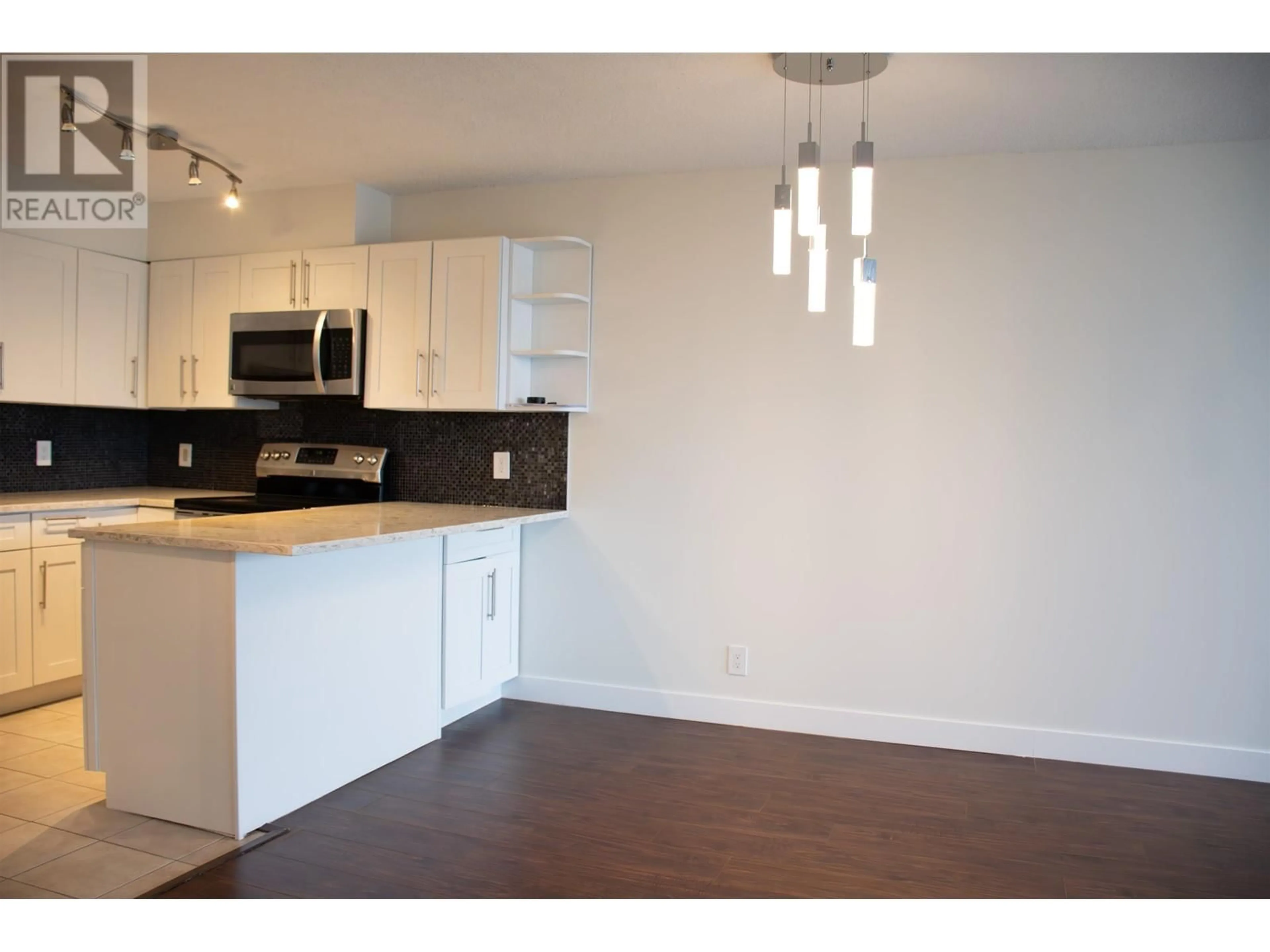 Open concept kitchen, wood/laminate floor for 1301 - 3970 CARRIGAN COURT, Burnaby British Columbia V3N4S5