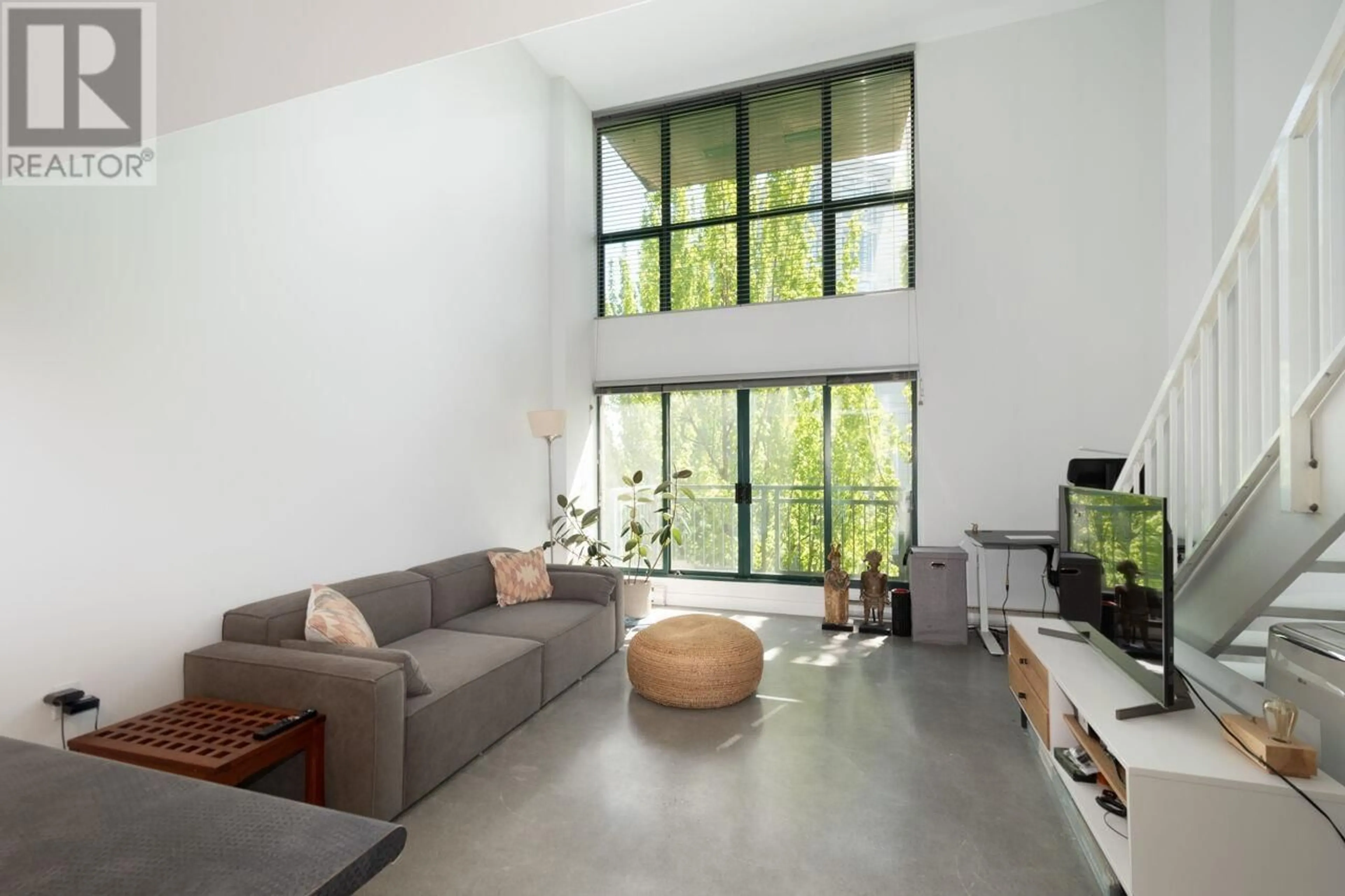 Living room with furniture, cement floor for 618 - 22 CORDOVA STREET, Vancouver British Columbia V6A4G8