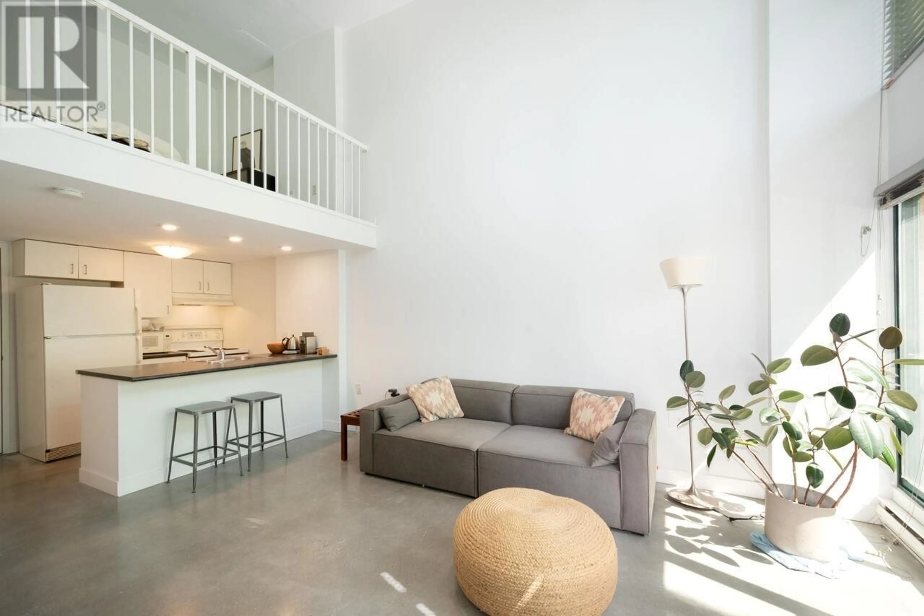 Living room with furniture, cement floor for 618 - 22 CORDOVA STREET, Vancouver British Columbia V6A4G8