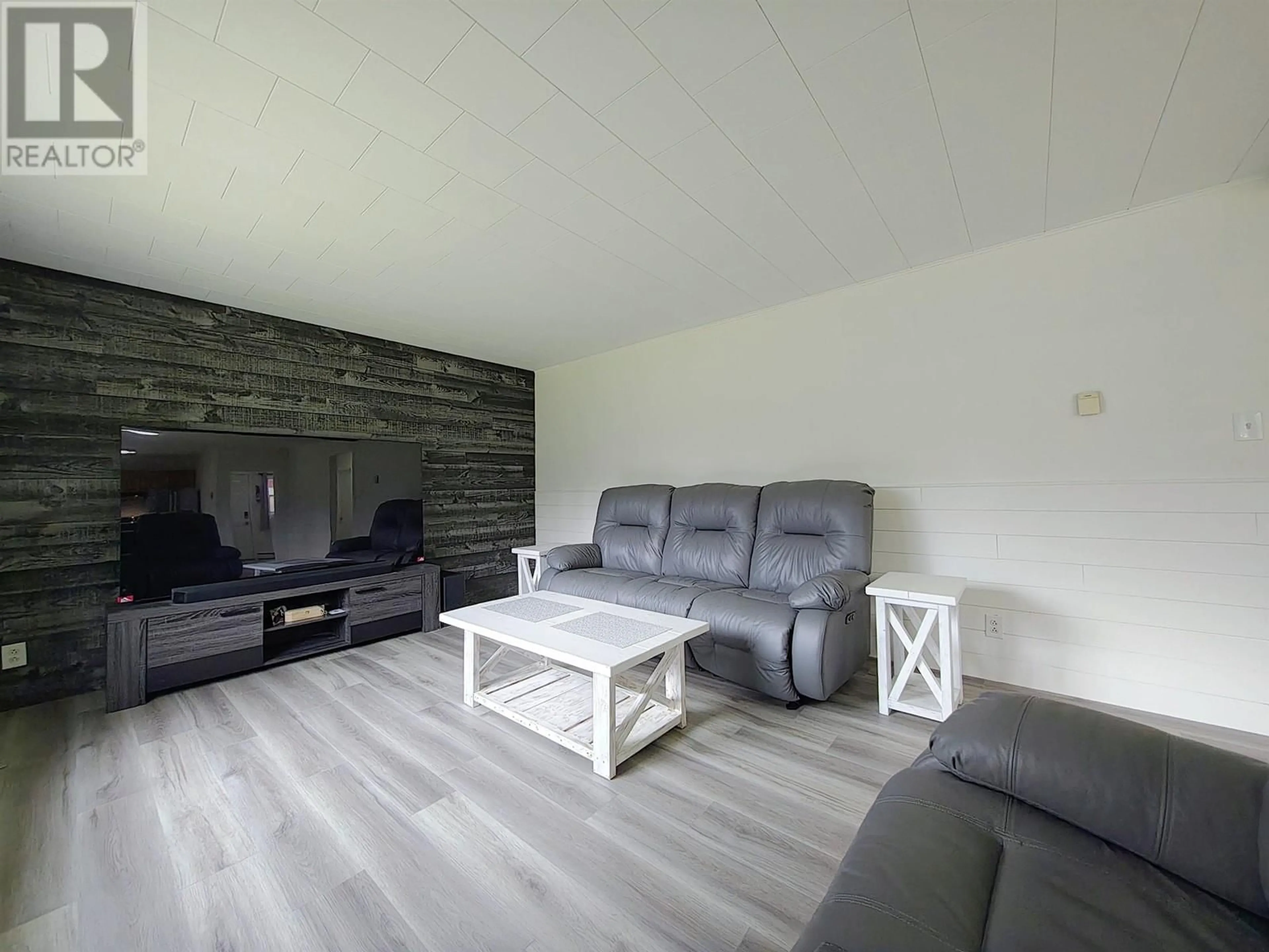Living room with furniture, wood/laminate floor for 426 MCKELVIE ROAD, Hixon British Columbia V0K1S1