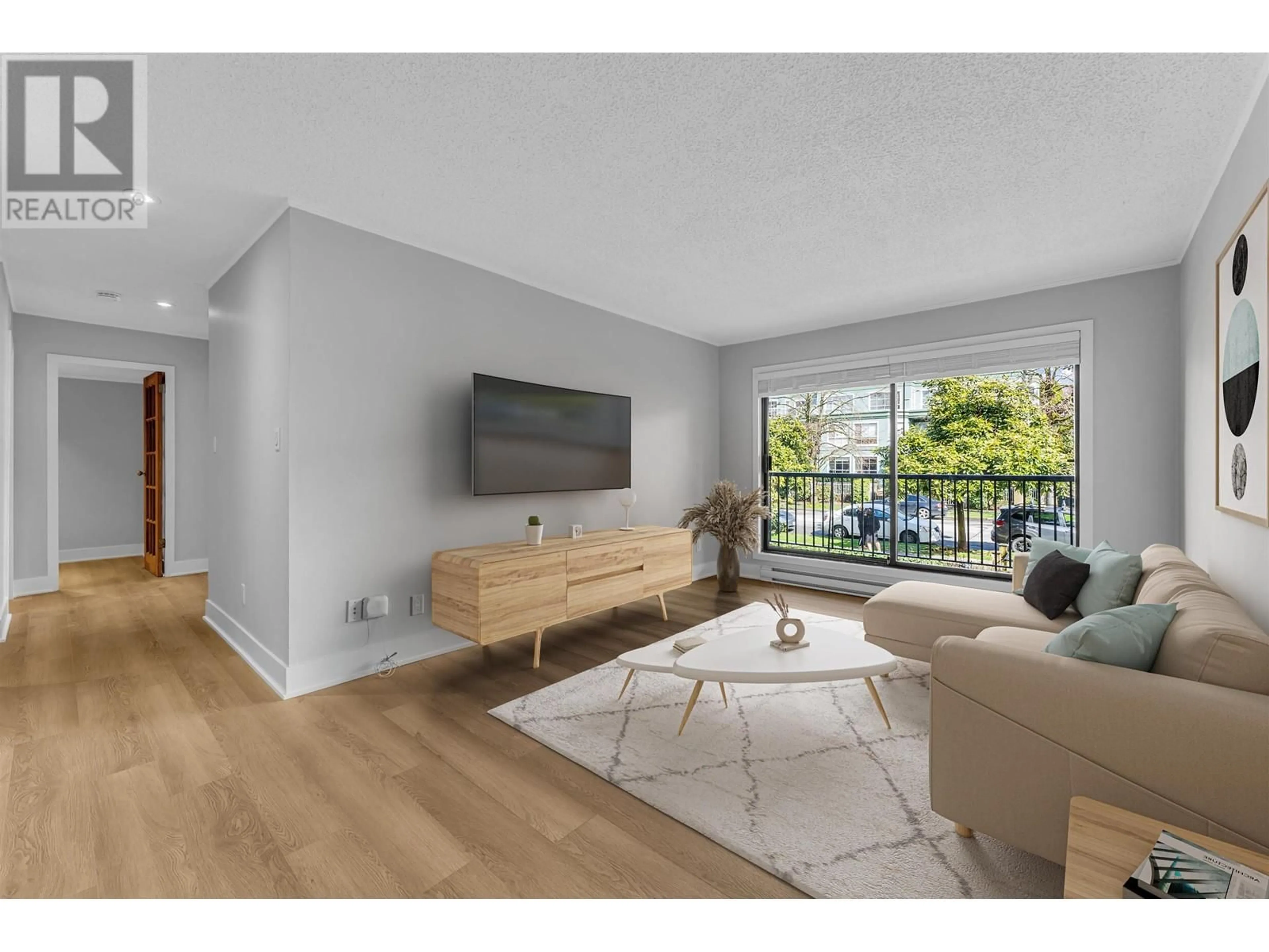 Living room with furniture, wood/laminate floor for 214 - 251 4TH STREET, North Vancouver British Columbia V7M1H8