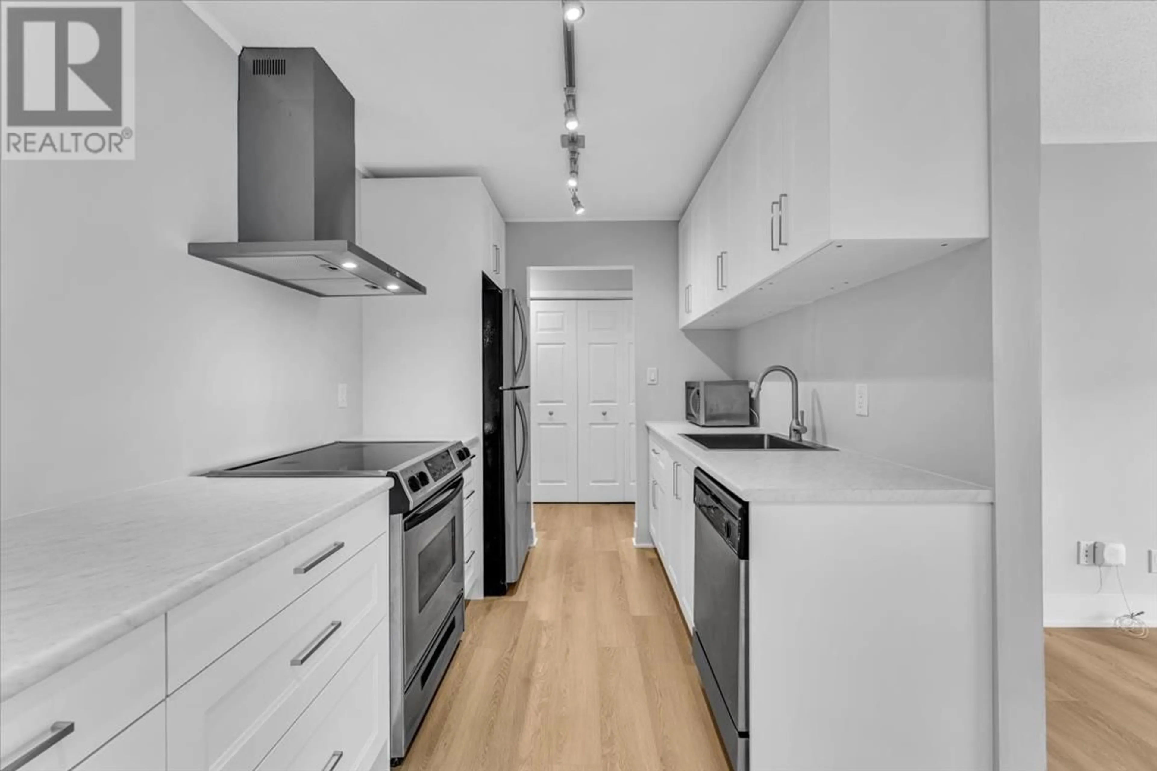Standard kitchen, wood/laminate floor for 214 - 251 4TH STREET, North Vancouver British Columbia V7M1H8