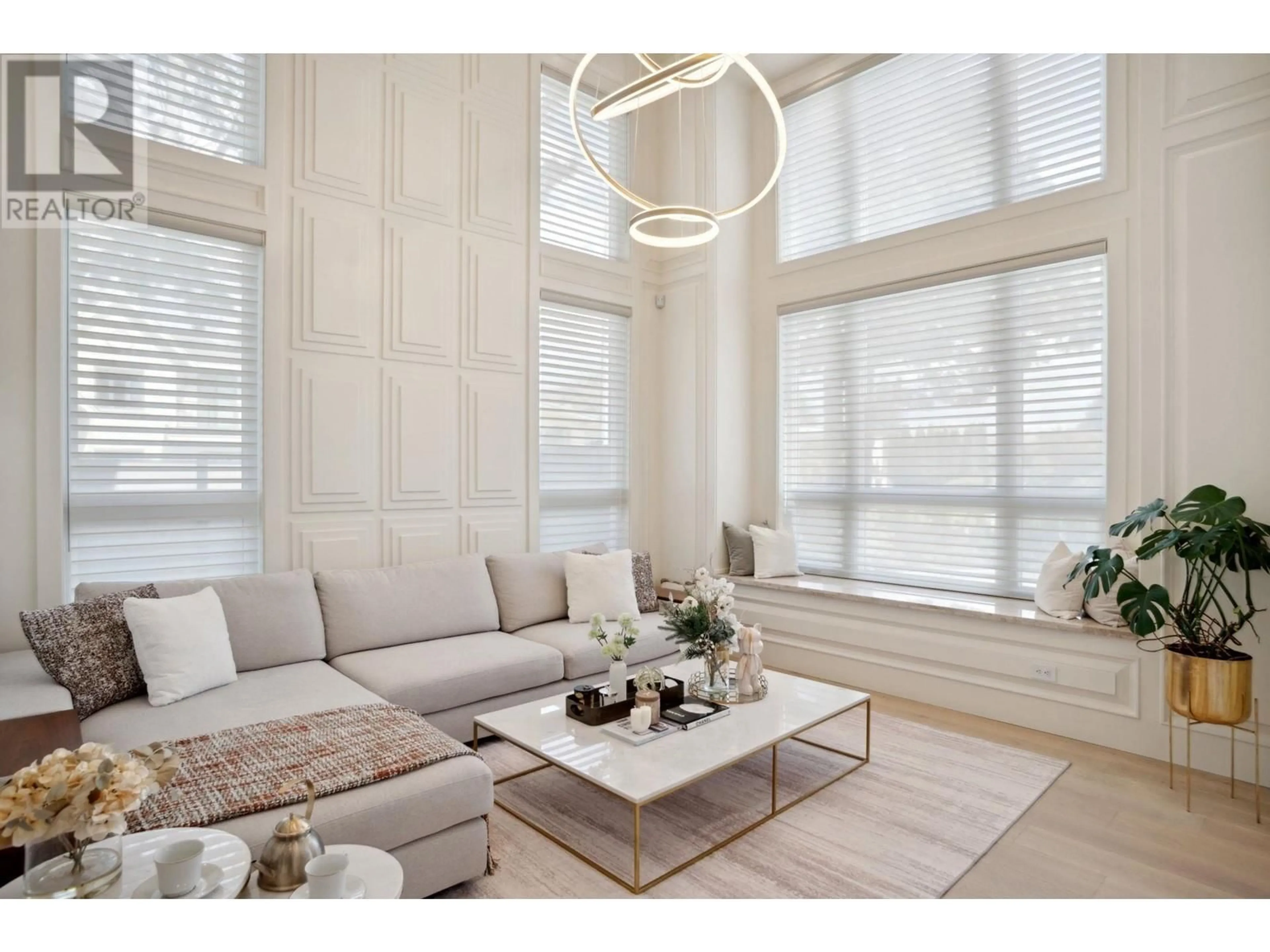 Living room with furniture, wood/laminate floor for 6311 COLTSFOOT DRIVE, Richmond British Columbia V7C2J5
