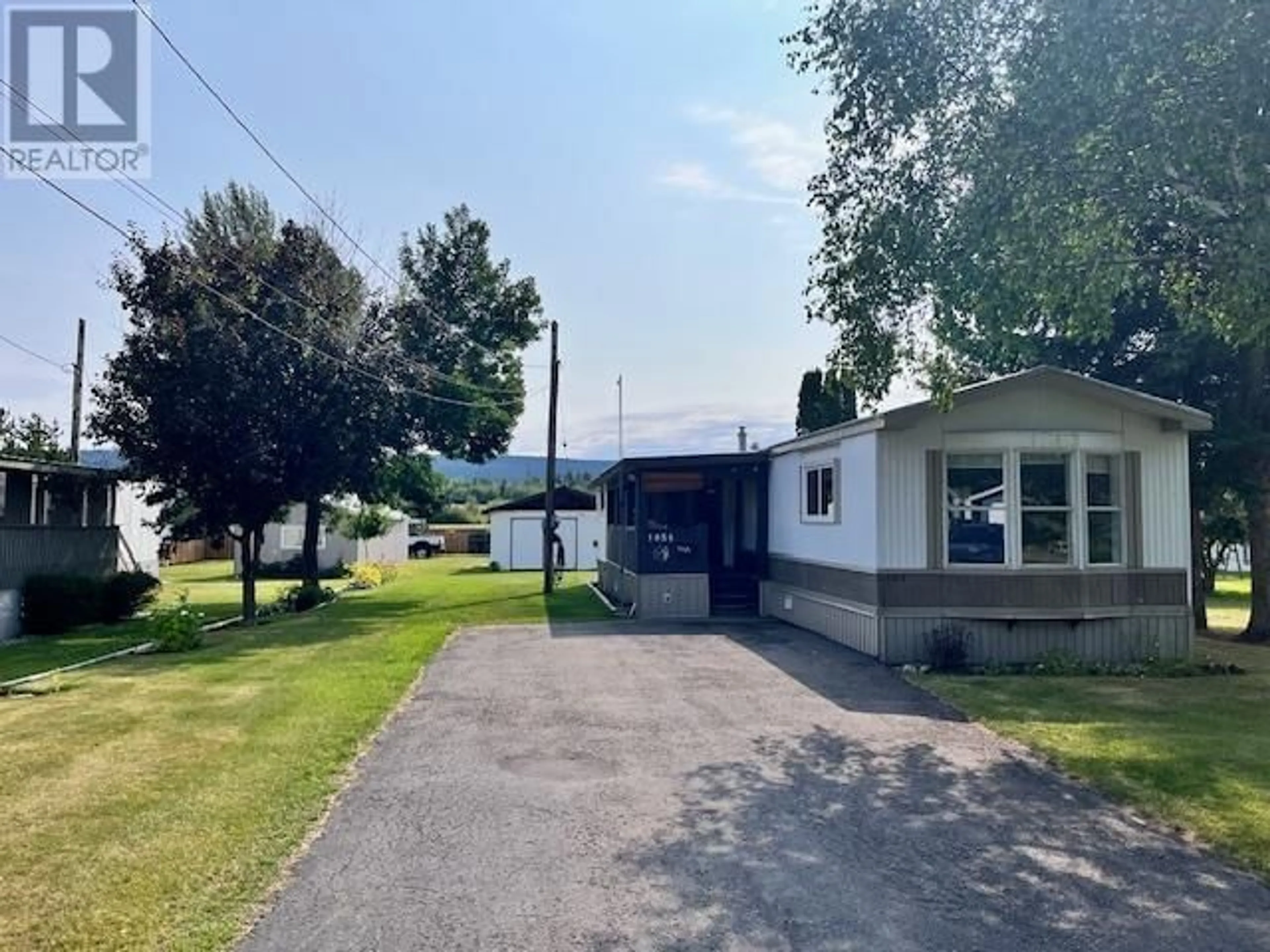 A pic from outside/outdoor area/front of a property/back of a property/a pic from drone, water/lake/river/ocean view for 1056 MAPLE HEIGHTS ROAD, Quesnel British Columbia V2J3X3