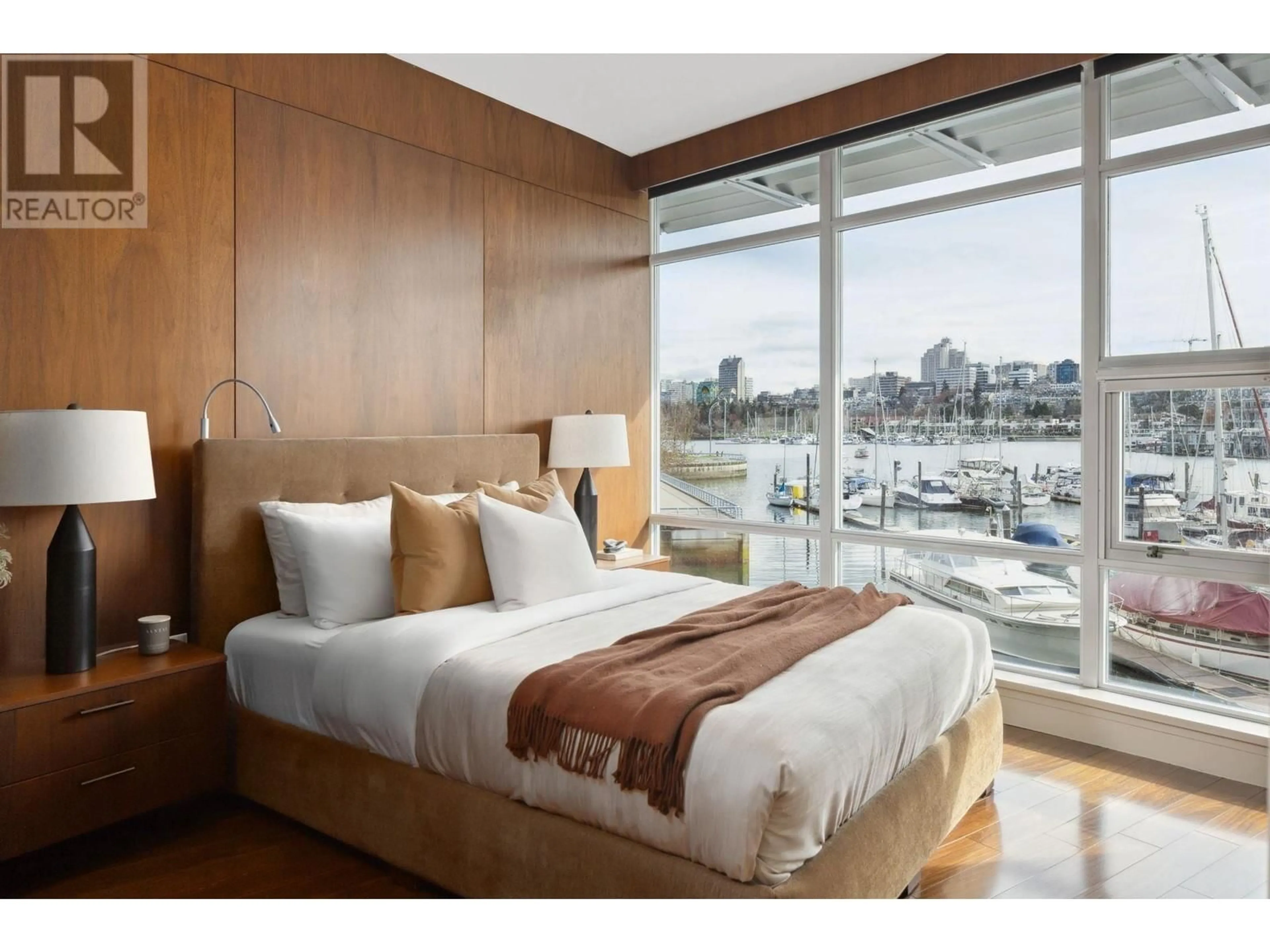 Bedroom with bed, wood/laminate floor for 202 - 628 KINGHORNE MEWS, Vancouver British Columbia V6Z3H6
