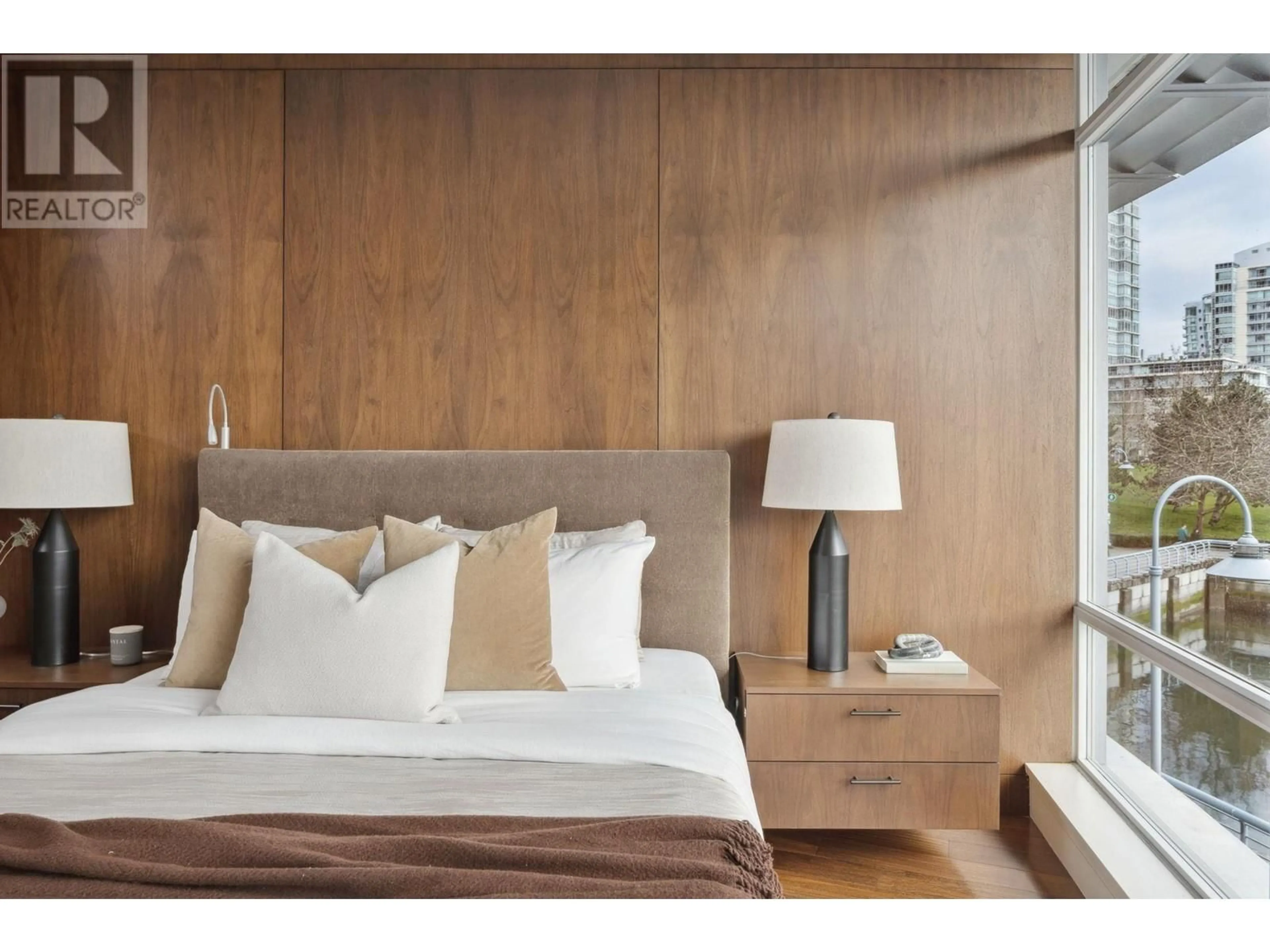 Bedroom with bed, wood/laminate floor for 202 - 628 KINGHORNE MEWS, Vancouver British Columbia V6Z3H6