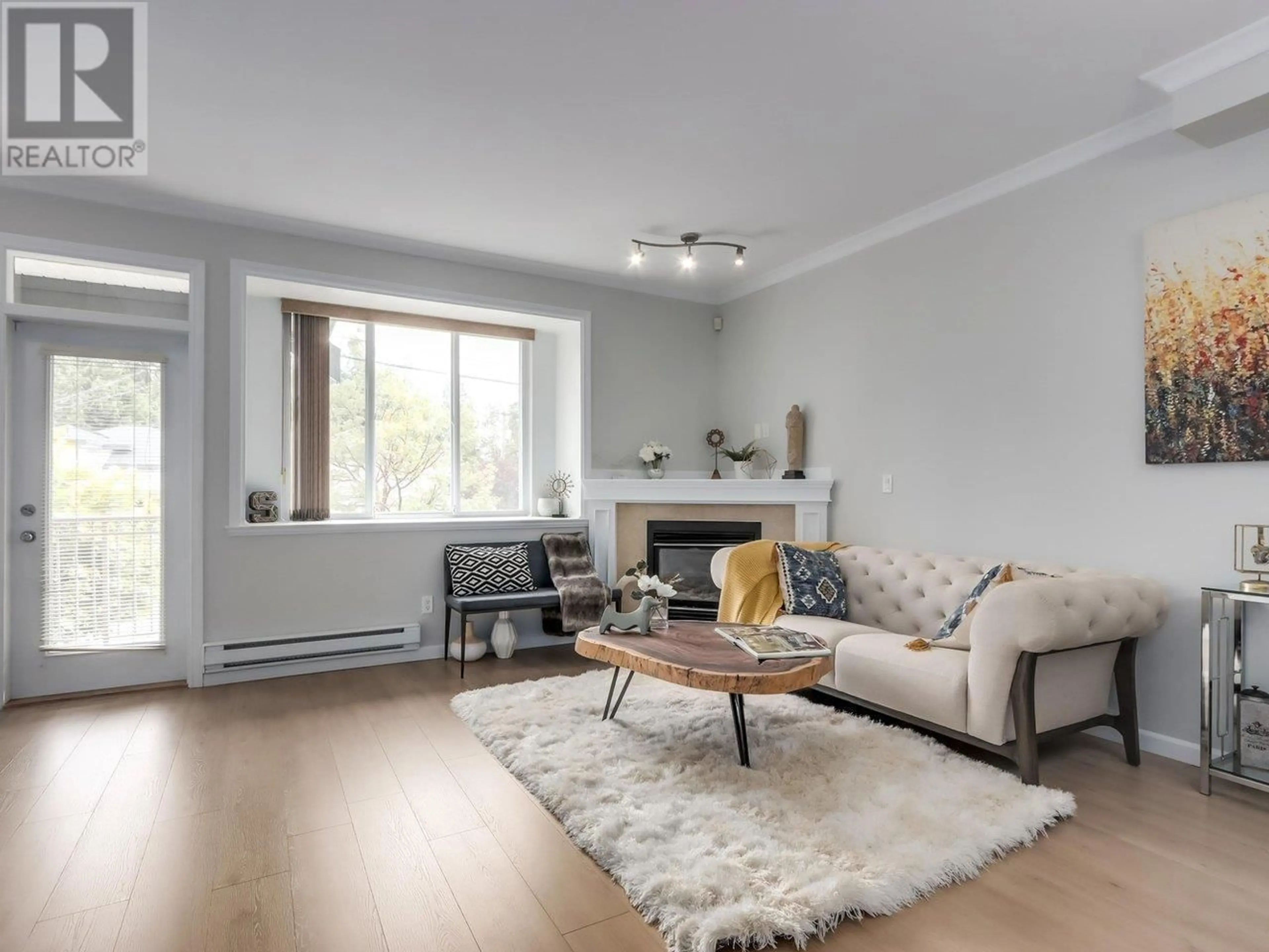 Living room with furniture, wood/laminate floor for 3 - 7400 HEATHER STREET, Richmond British Columbia V6Y2P6