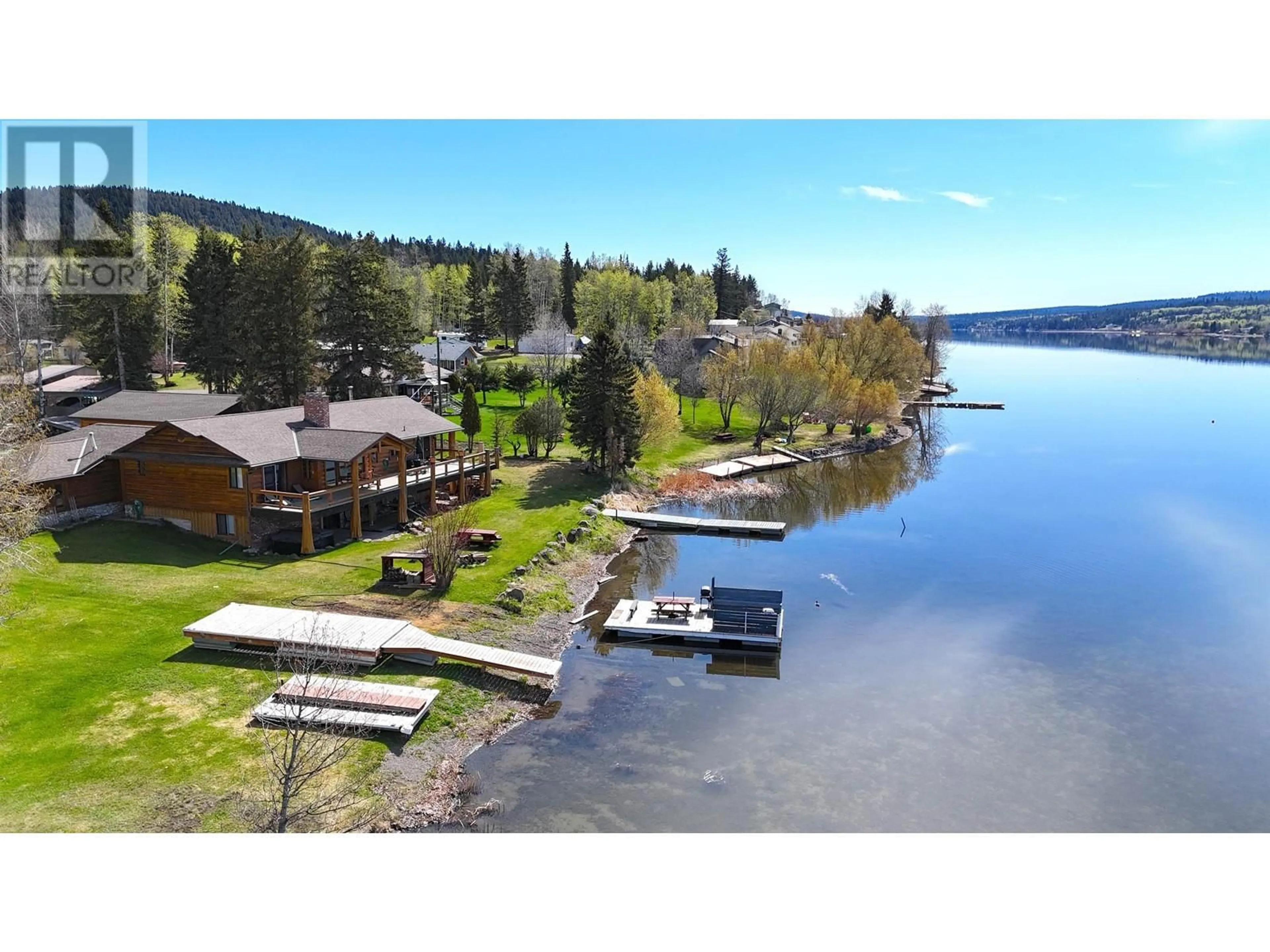 A pic from outside/outdoor area/front of a property/back of a property/a pic from drone, water/lake/river/ocean view for 6126 LAKESHORE DRIVE, 100 Mile House British Columbia V0K2E3