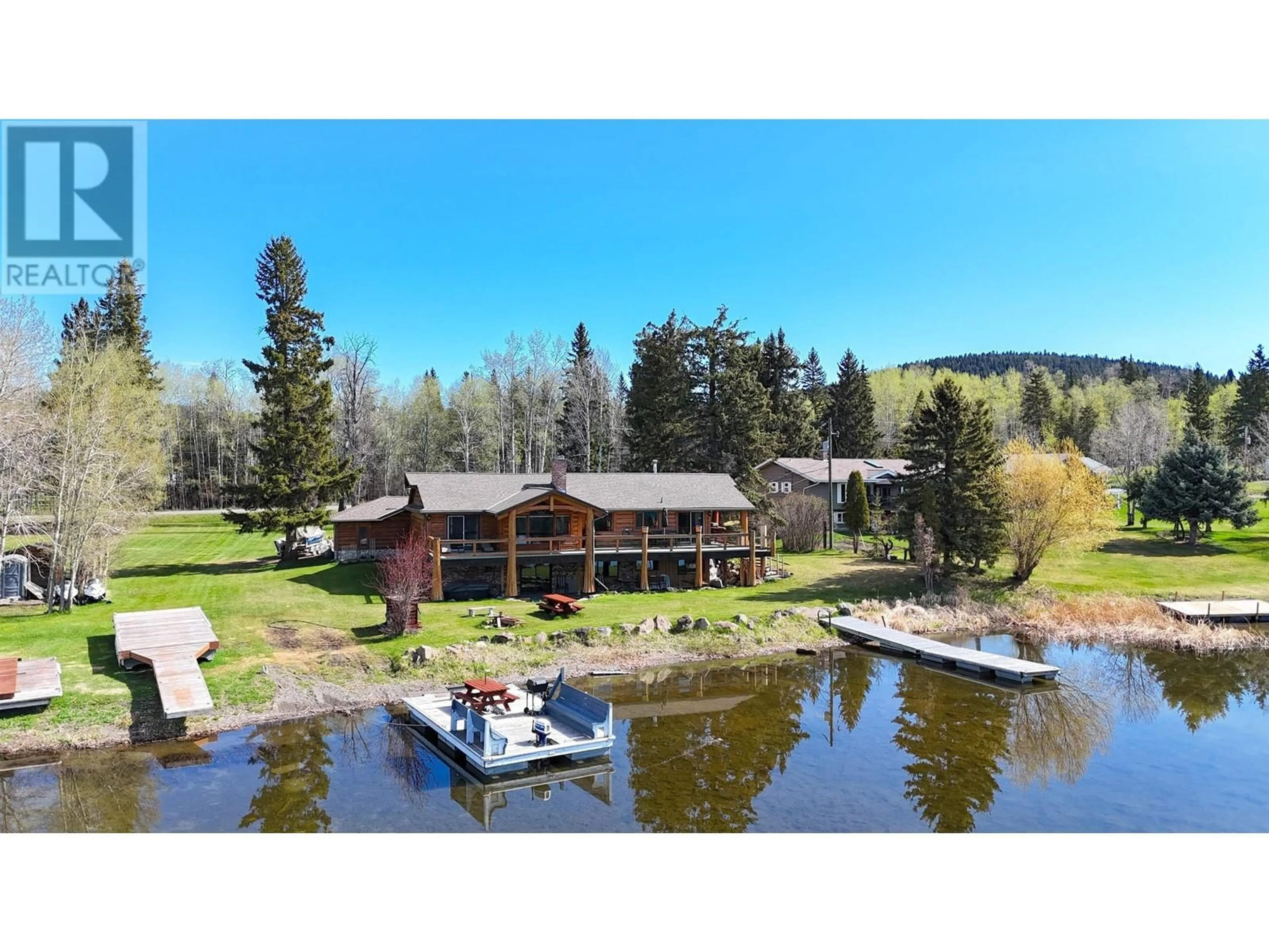 A pic from outside/outdoor area/front of a property/back of a property/a pic from drone, water/lake/river/ocean view for 6126 LAKESHORE DRIVE, 100 Mile House British Columbia V0K2E3
