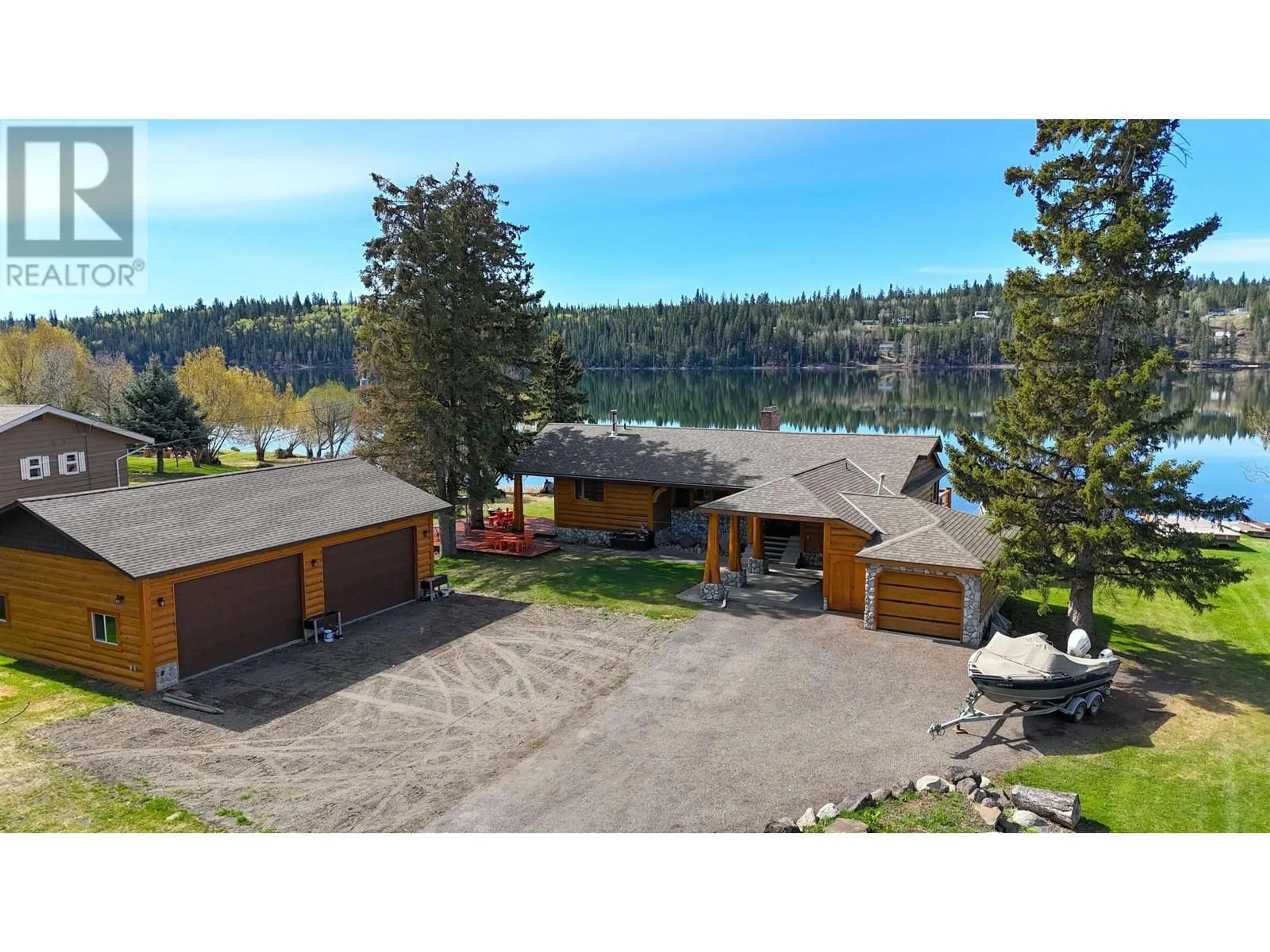 A pic from outside/outdoor area/front of a property/back of a property/a pic from drone, water/lake/river/ocean view for 6126 LAKESHORE DRIVE, 100 Mile House British Columbia V0K2E3
