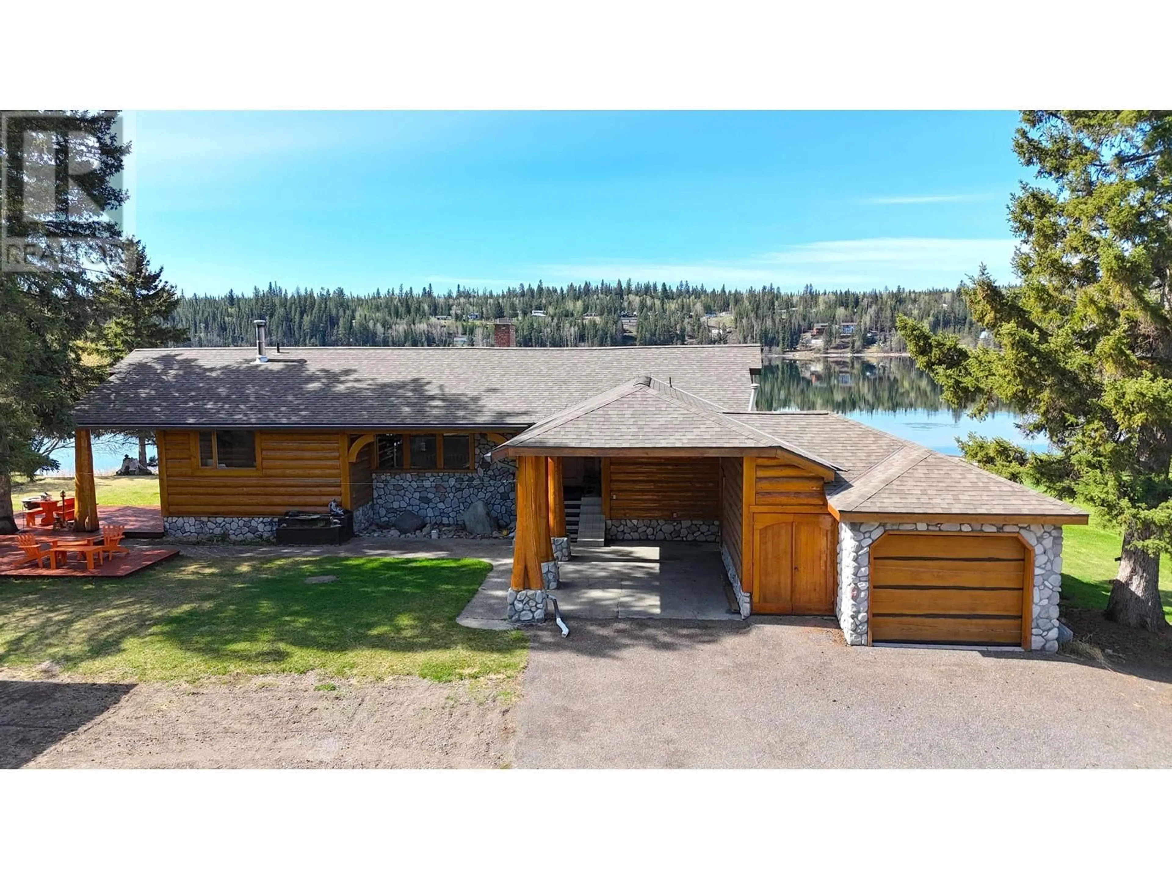 A pic from outside/outdoor area/front of a property/back of a property/a pic from drone, water/lake/river/ocean view for 6126 LAKESHORE DRIVE, 100 Mile House British Columbia V0K2E3