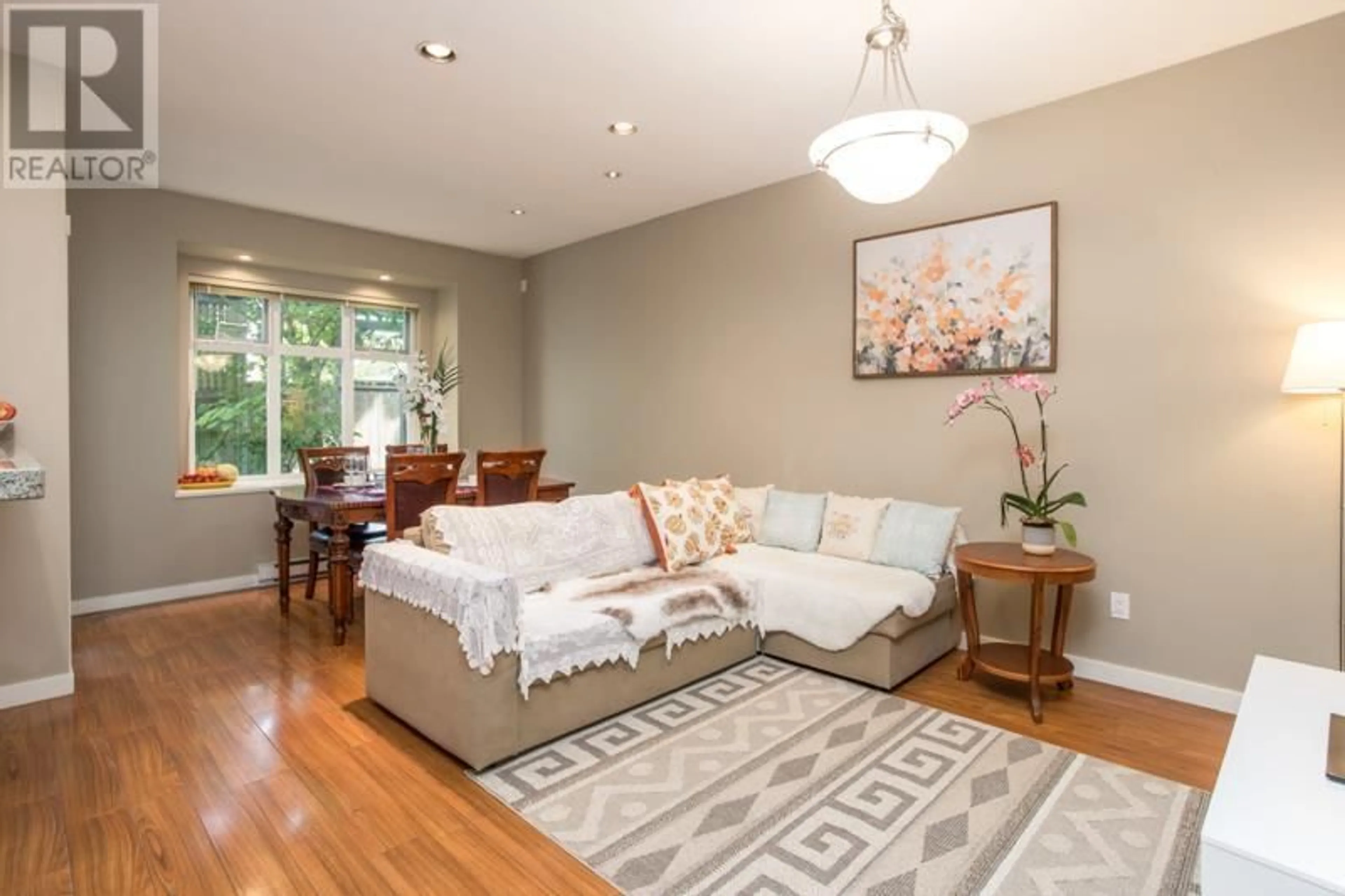 Living room with furniture, wood/laminate floor for 16 - 8600 NO. 3 ROAD, Richmond British Columbia V6Y2E8