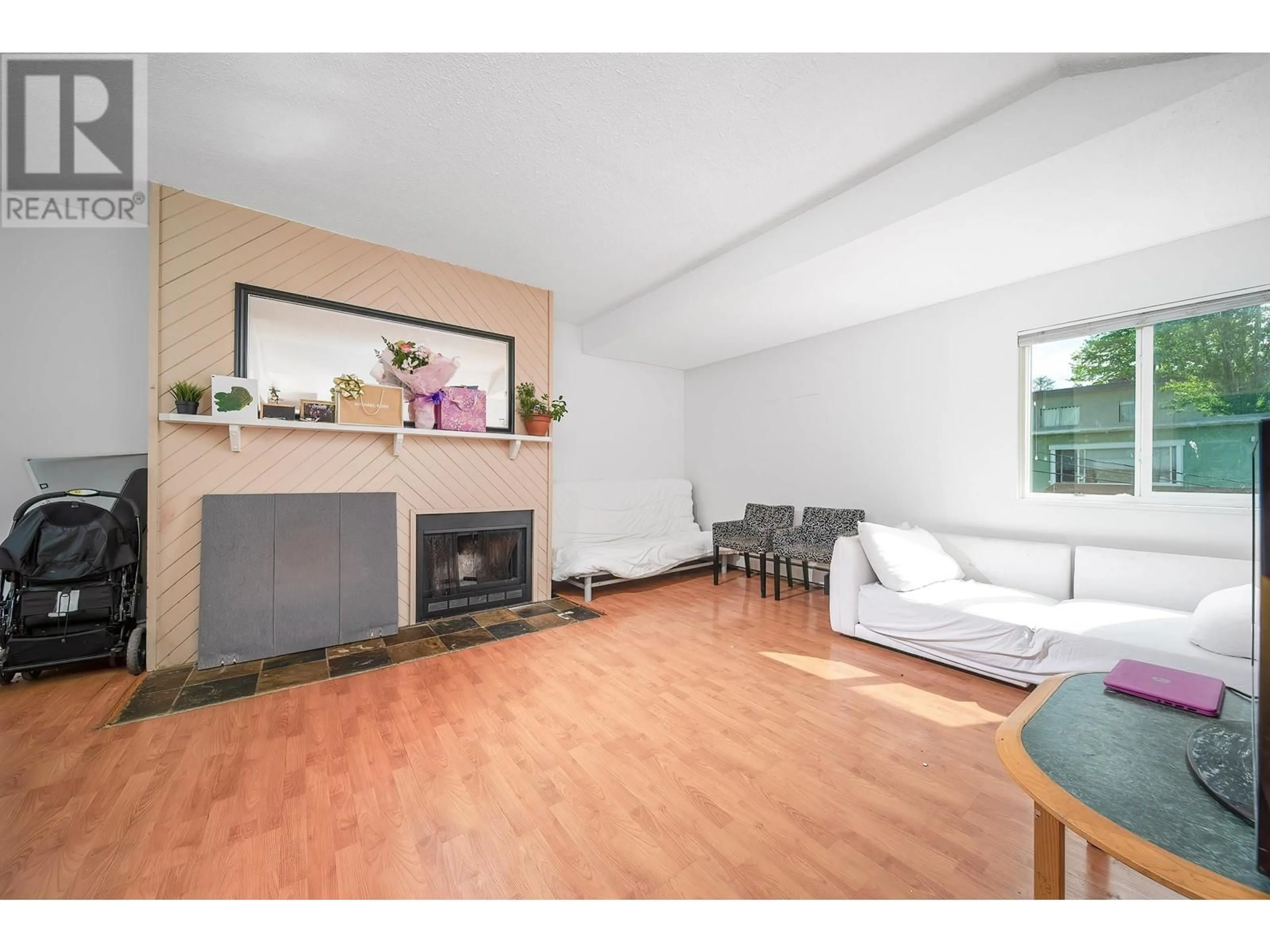 Living room with furniture, wood/laminate floor for 5146 HASTINGS STREET, Burnaby British Columbia V5B1P6