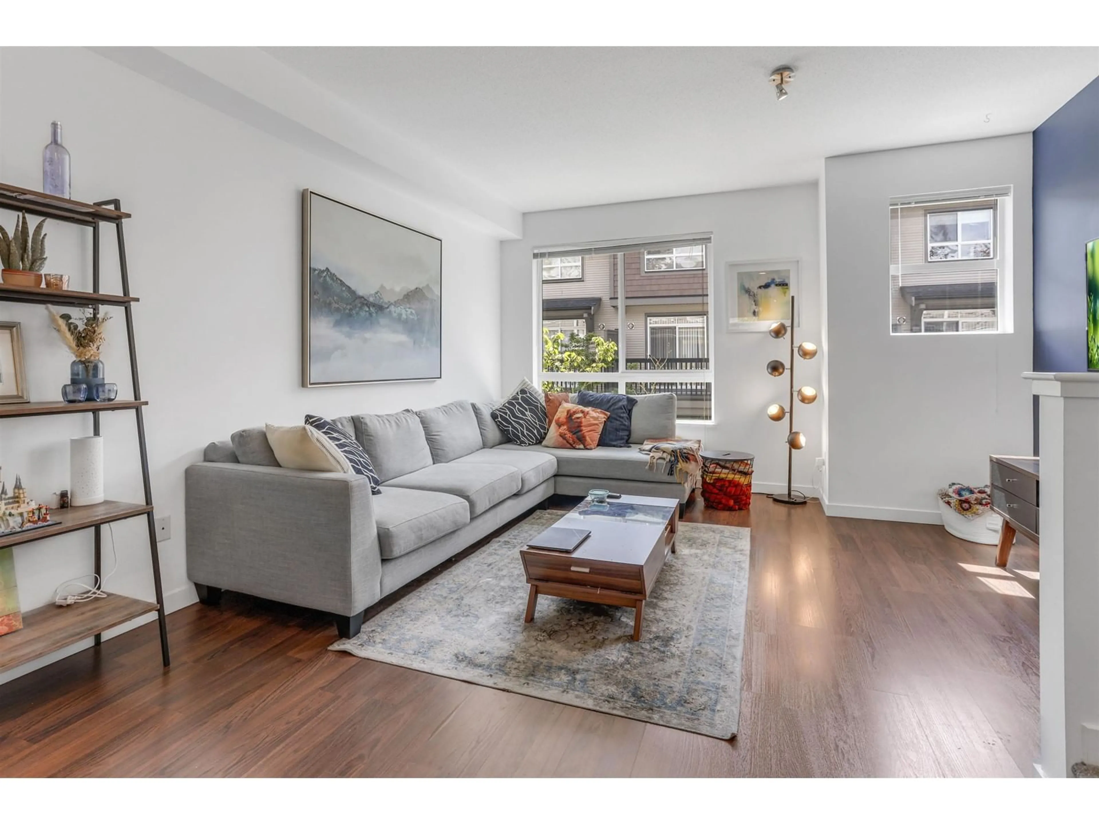 Living room with furniture, wood/laminate floor for 115 - 2729 158, Surrey British Columbia V3Z1P4