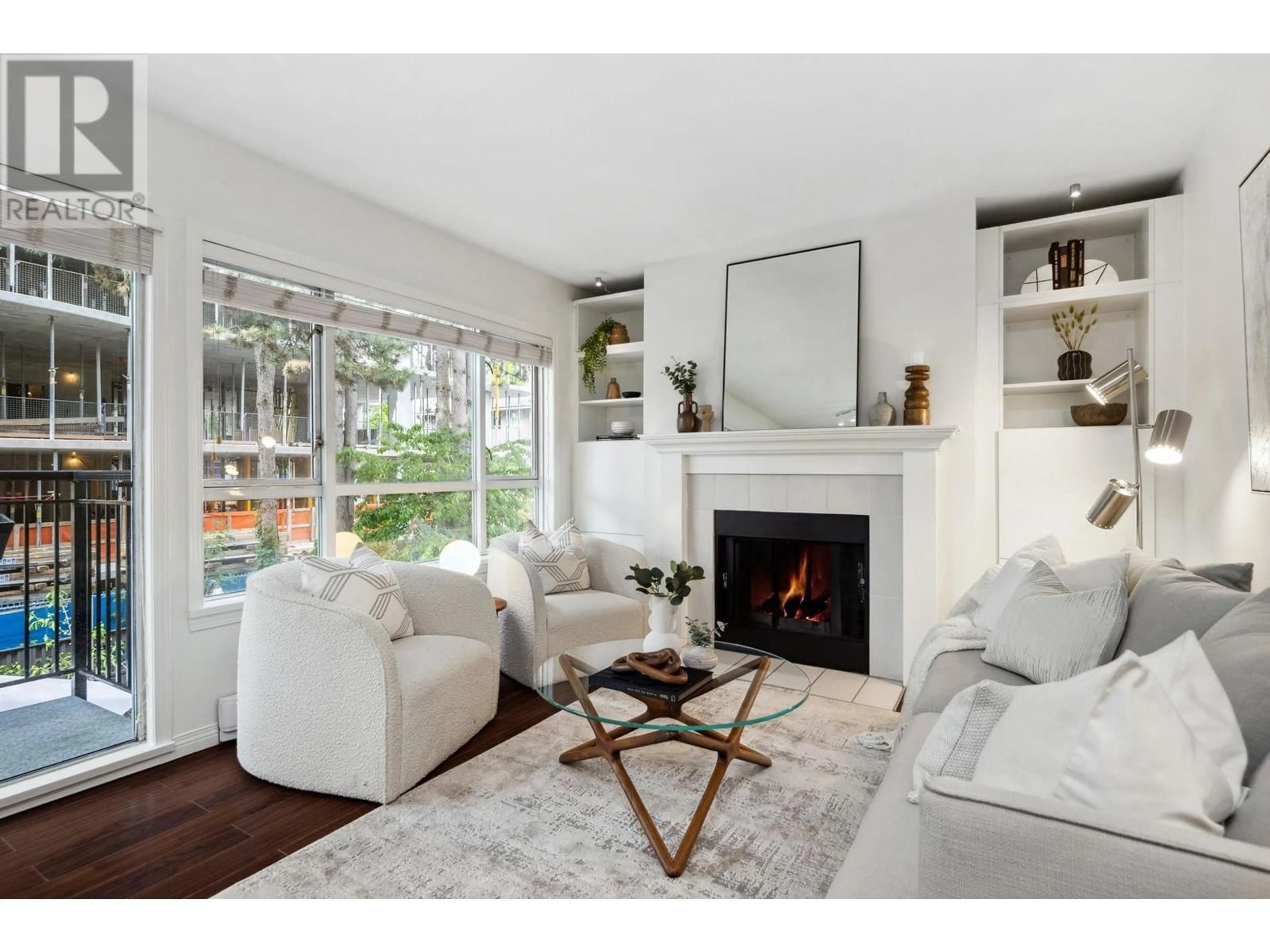 Living room with furniture, wood/laminate floor for 203 - 555 14TH AVENUE, Vancouver British Columbia V5Z4G8