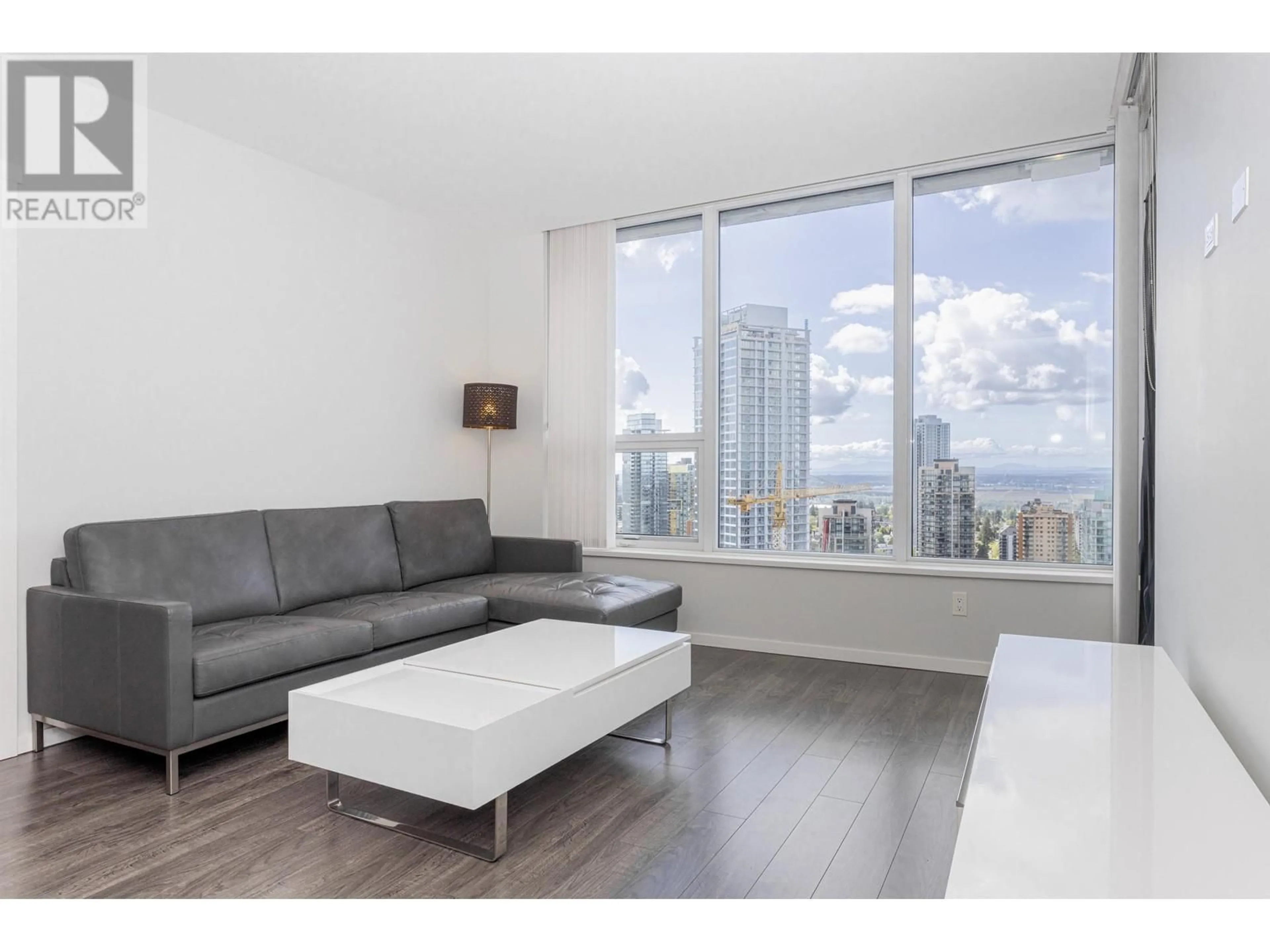Living room with furniture, wood/laminate floor for 3905 - 5883 BARKER AVENUE, Burnaby British Columbia V5H0G4
