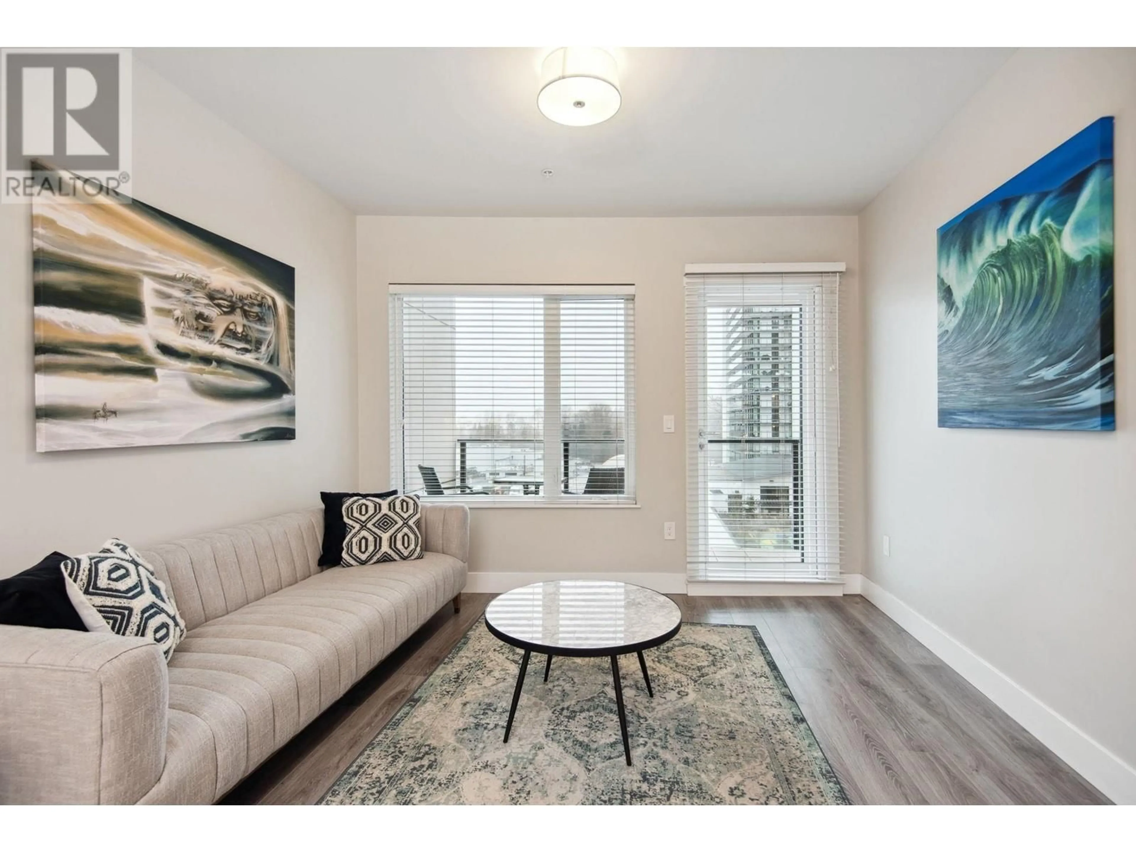 Living room with furniture, wood/laminate floor for 603 - 1496 CHARLOTTE ROAD, North Vancouver British Columbia V7J0C9