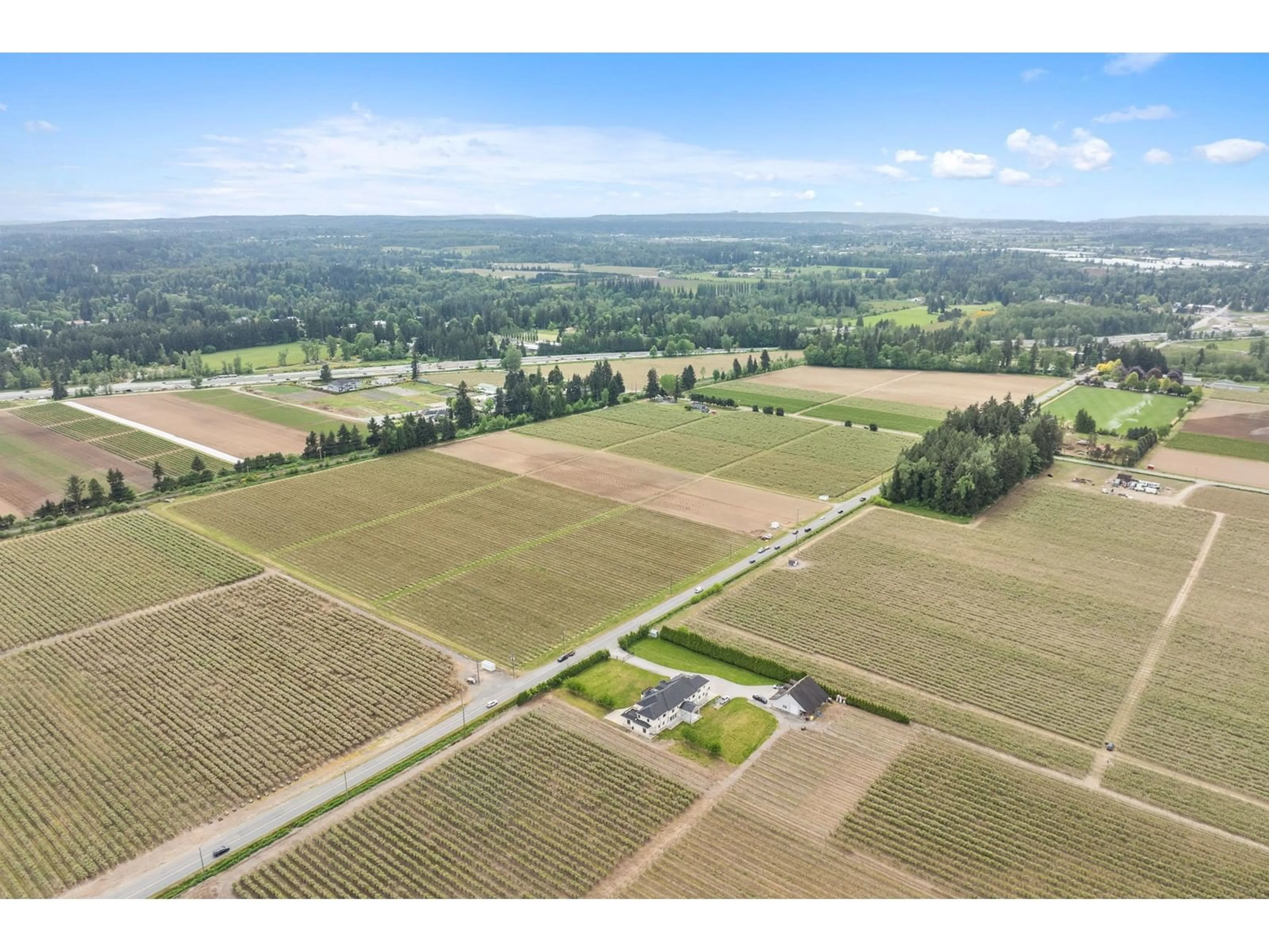 A pic from outside/outdoor area/front of a property/back of a property/a pic from drone, unknown for 7060 240, Langley British Columbia V1M3P8