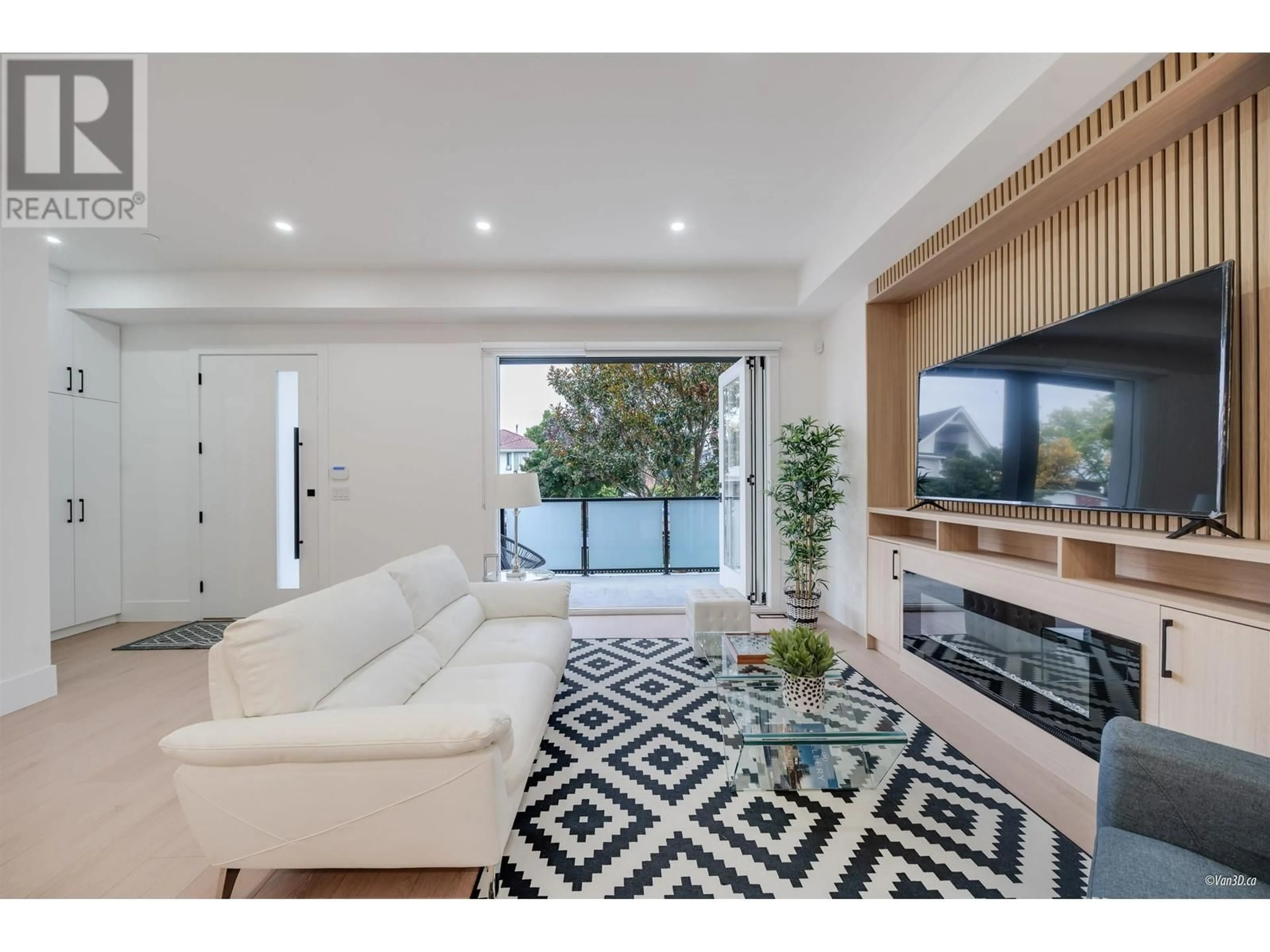 Living room with furniture, wood/laminate floor for 1 - 6964 INVERNESS STREET, Vancouver British Columbia V5X4G5