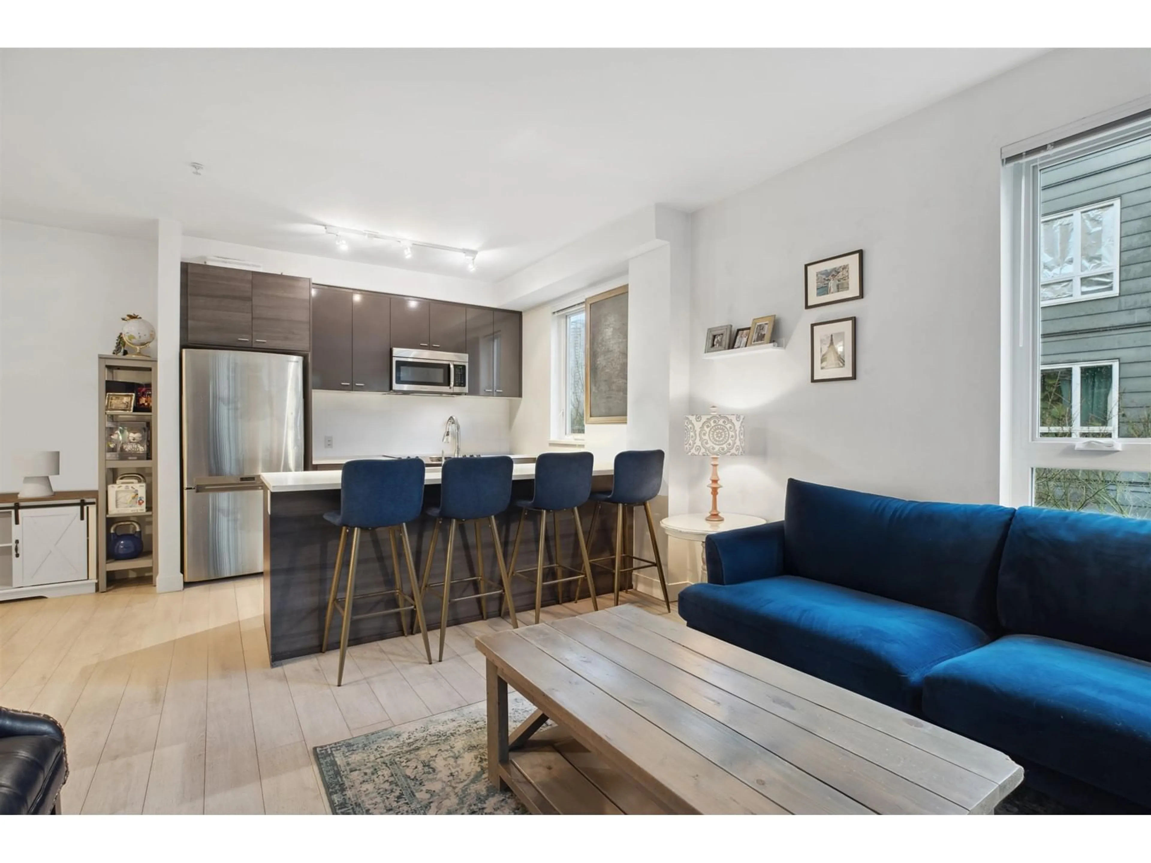 Open concept kitchen, wood/laminate floor for 212 - 13925 FRASER, Surrey British Columbia V3T4E6