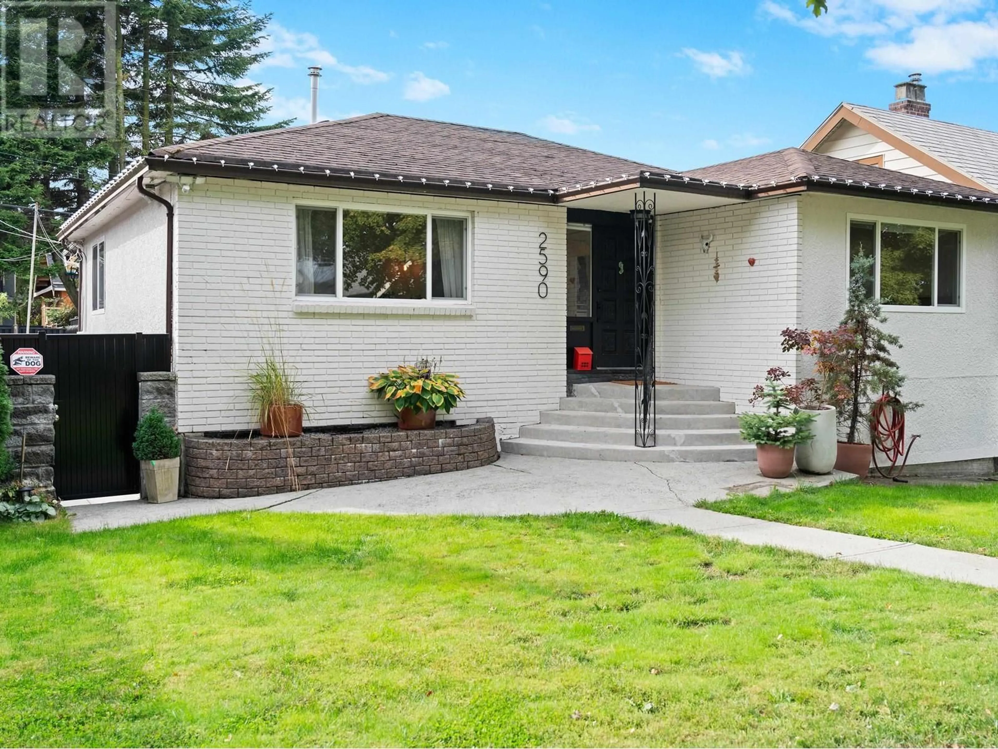 Home with brick exterior material, street for 2590 ADANAC STREET, Vancouver British Columbia V5K2M5