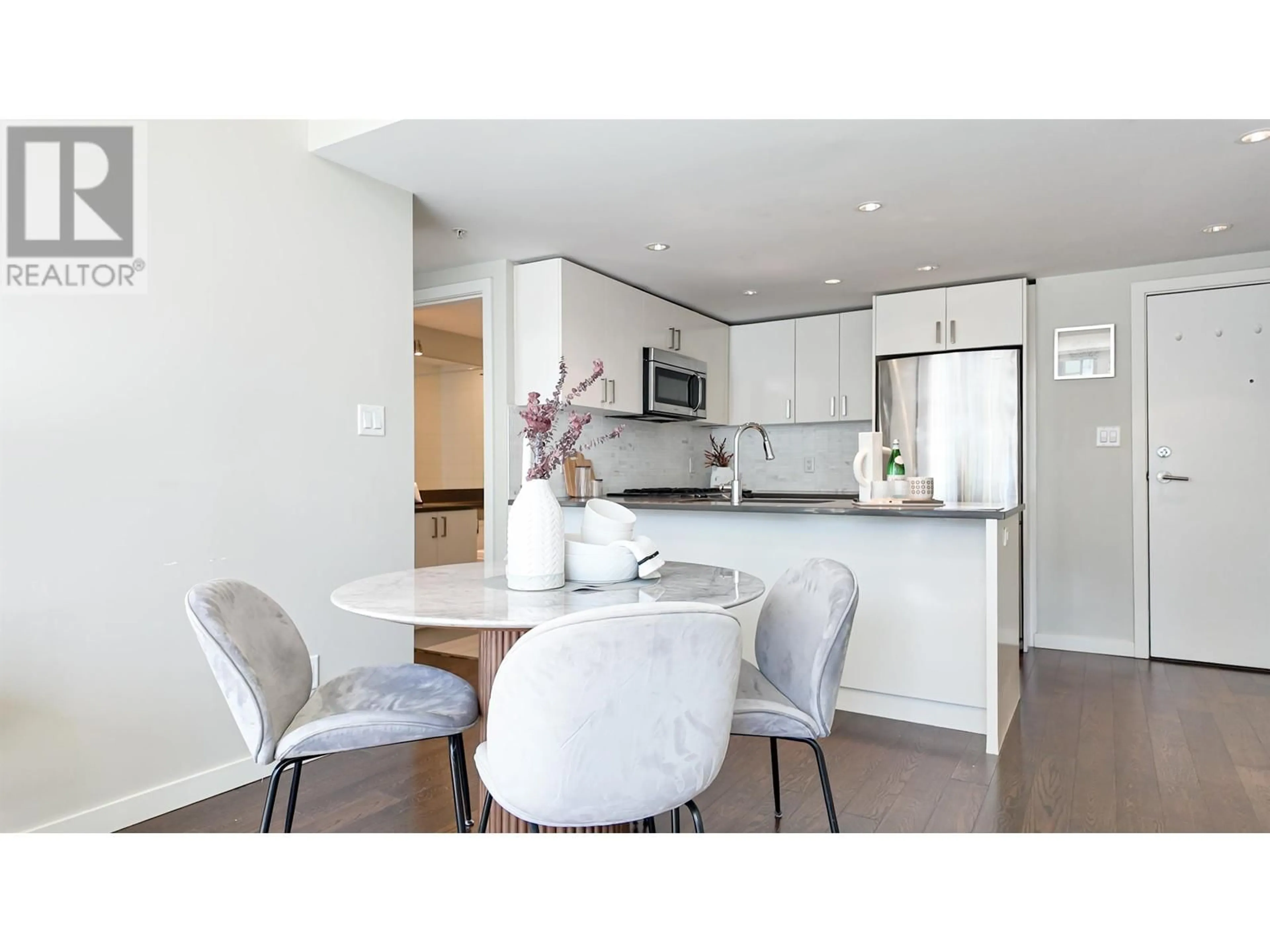 Open concept kitchen, wood/laminate floor for 1002 - 7117 ELMBRIDGE WAY, Richmond British Columbia V6X0J2
