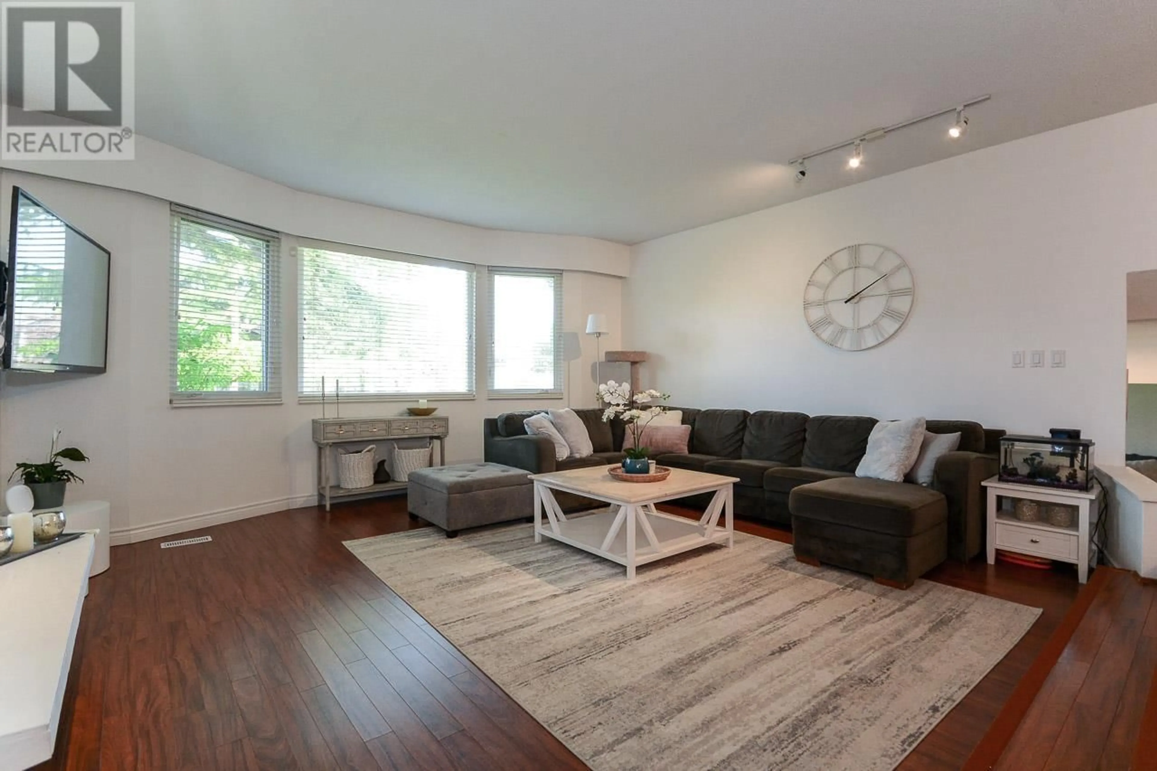 Living room with furniture, wood/laminate floor for 1345 53A STREET, Delta British Columbia V4M3E8