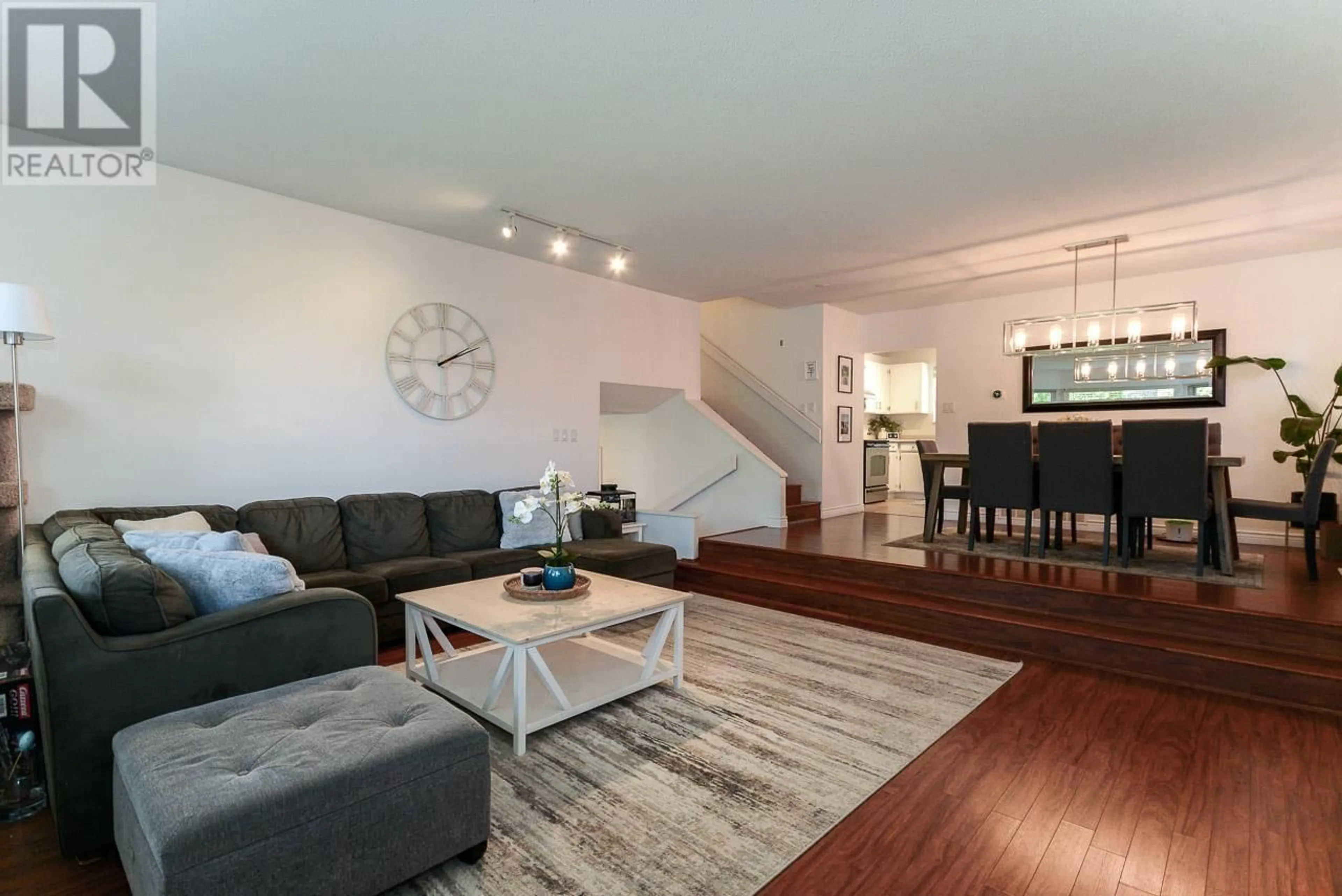 Living room with furniture, wood/laminate floor for 1345 53A STREET, Delta British Columbia V4M3E8