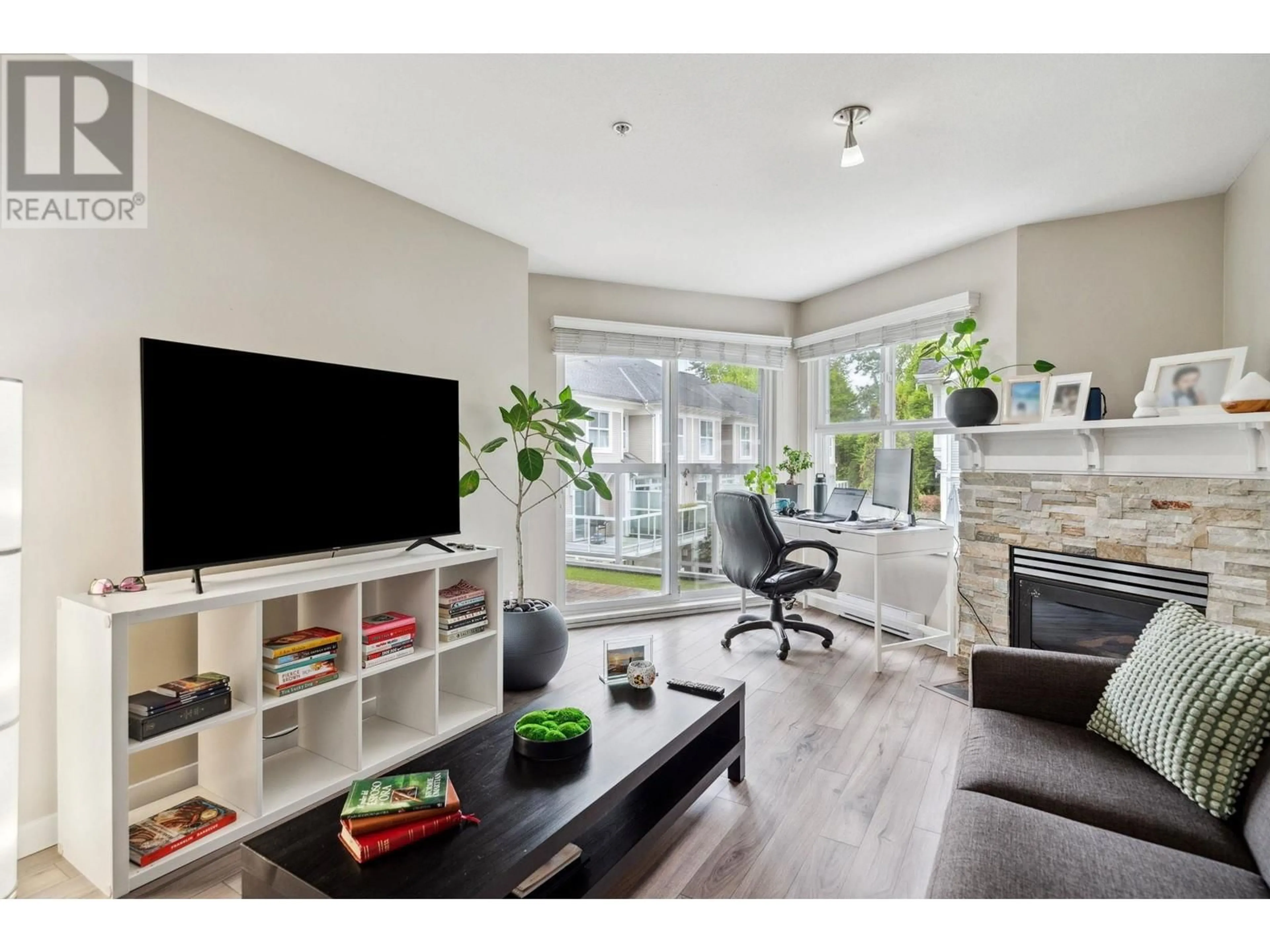 Living room with furniture, wood/laminate floor for 203 - 3038 KENT AVENUE, Vancouver British Columbia V5S4V8