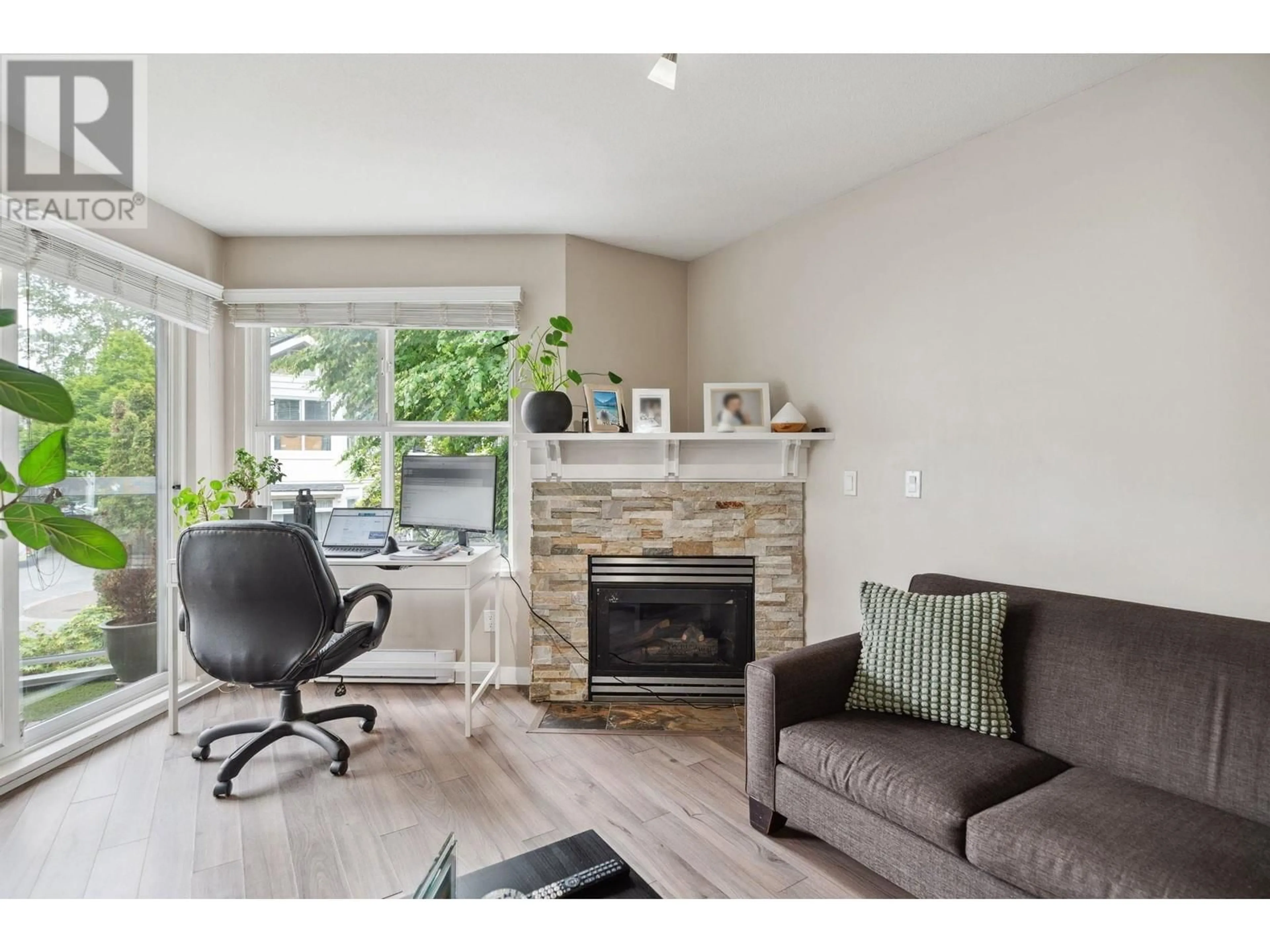 Living room with furniture, wood/laminate floor for 203 - 3038 KENT AVENUE, Vancouver British Columbia V5S4V8