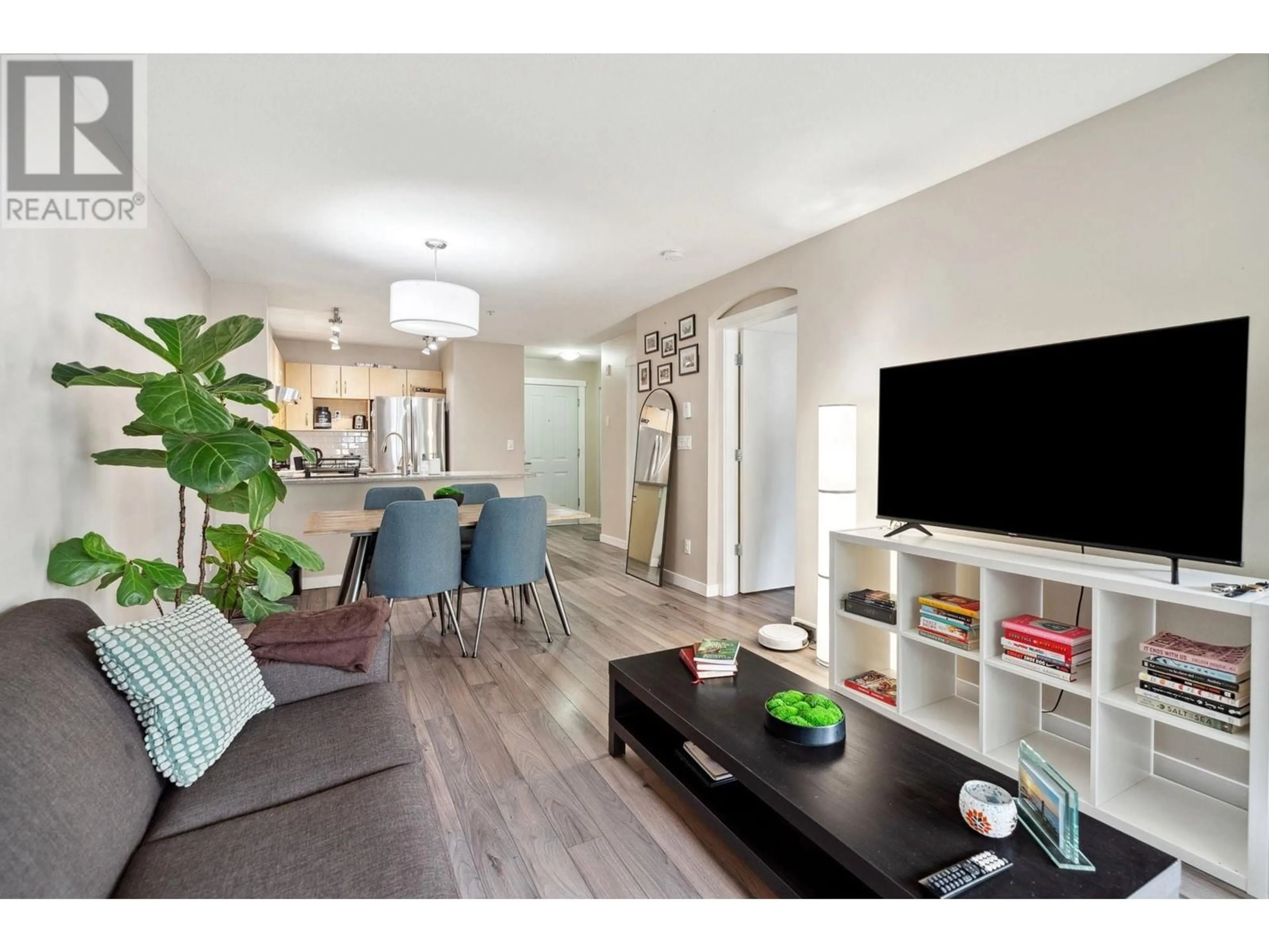 Living room with furniture, wood/laminate floor for 203 - 3038 KENT AVENUE, Vancouver British Columbia V5S4V8