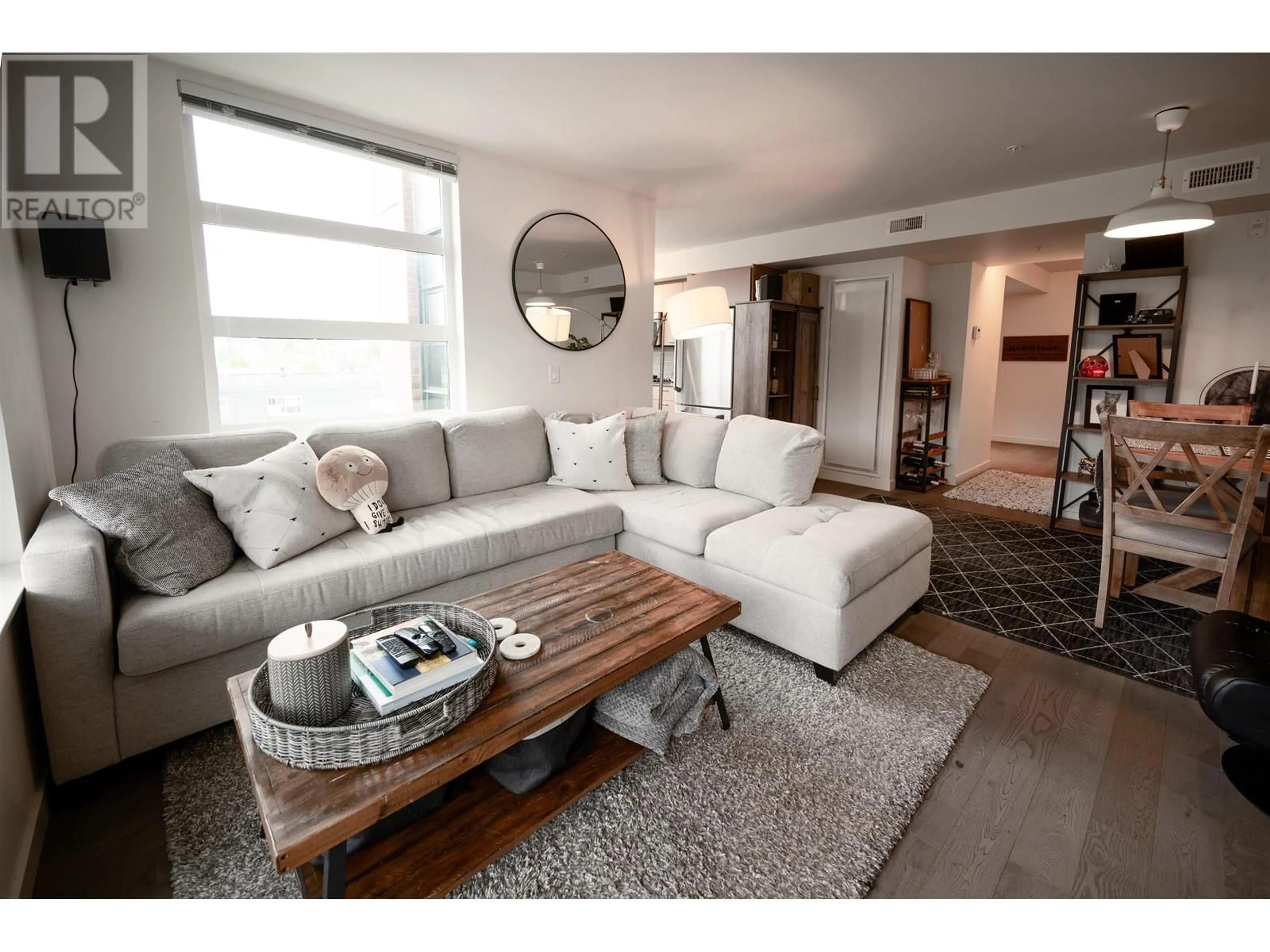 Living room with furniture, wood/laminate floor for 401 - 95 MOODY STREET, Port Moody British Columbia V3H0H2