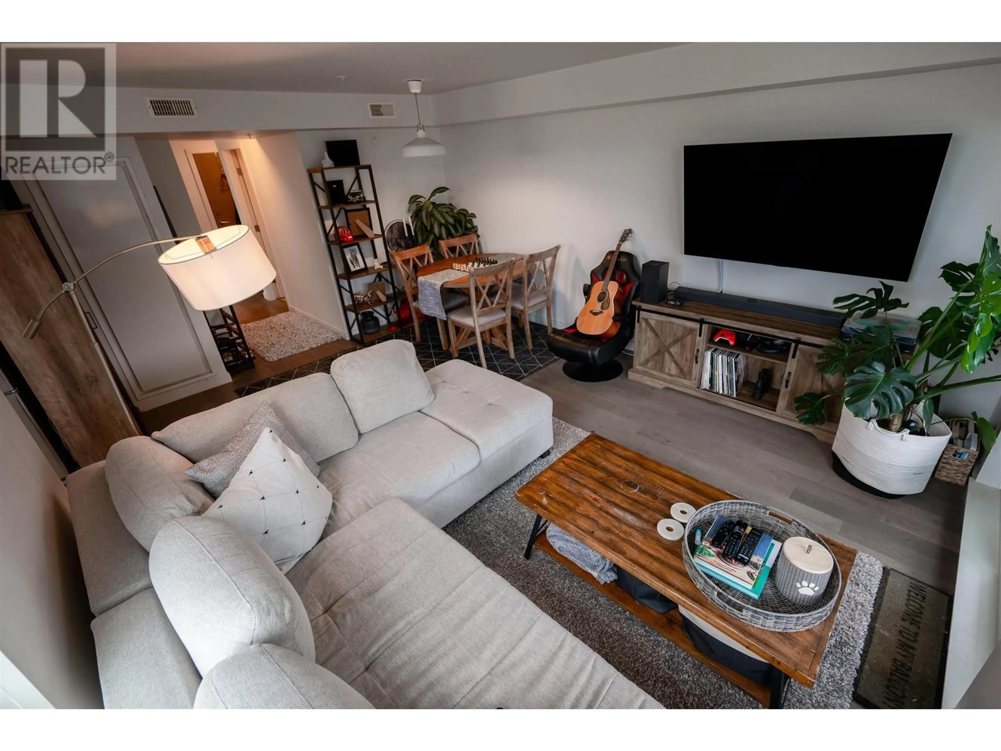 Living room with furniture, wood/laminate floor for 401 - 95 MOODY STREET, Port Moody British Columbia V3H0H2