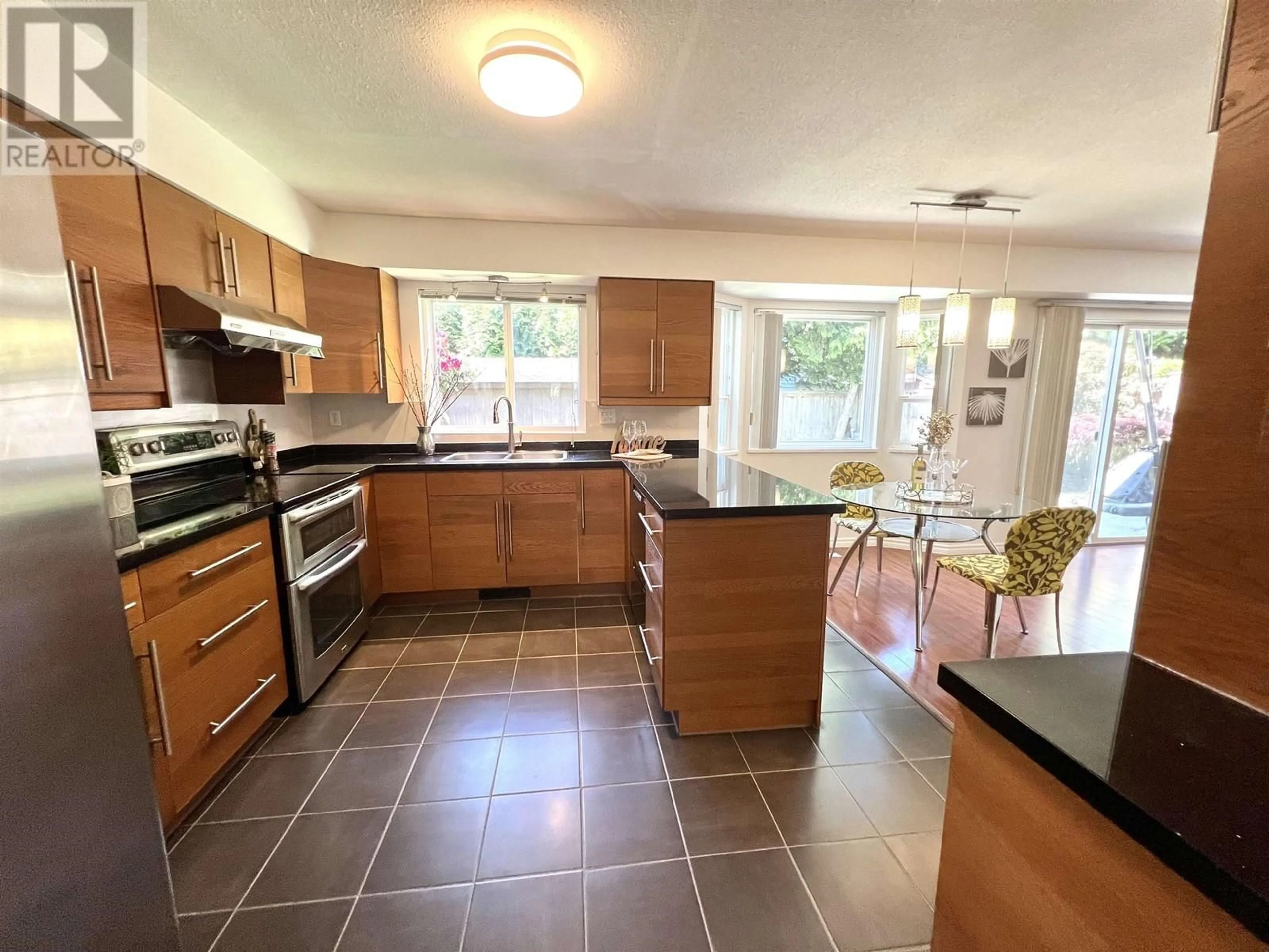 Open concept kitchen, ceramic/tile floor for 8711 DELAWARE ROAD, Richmond British Columbia V7C4X6