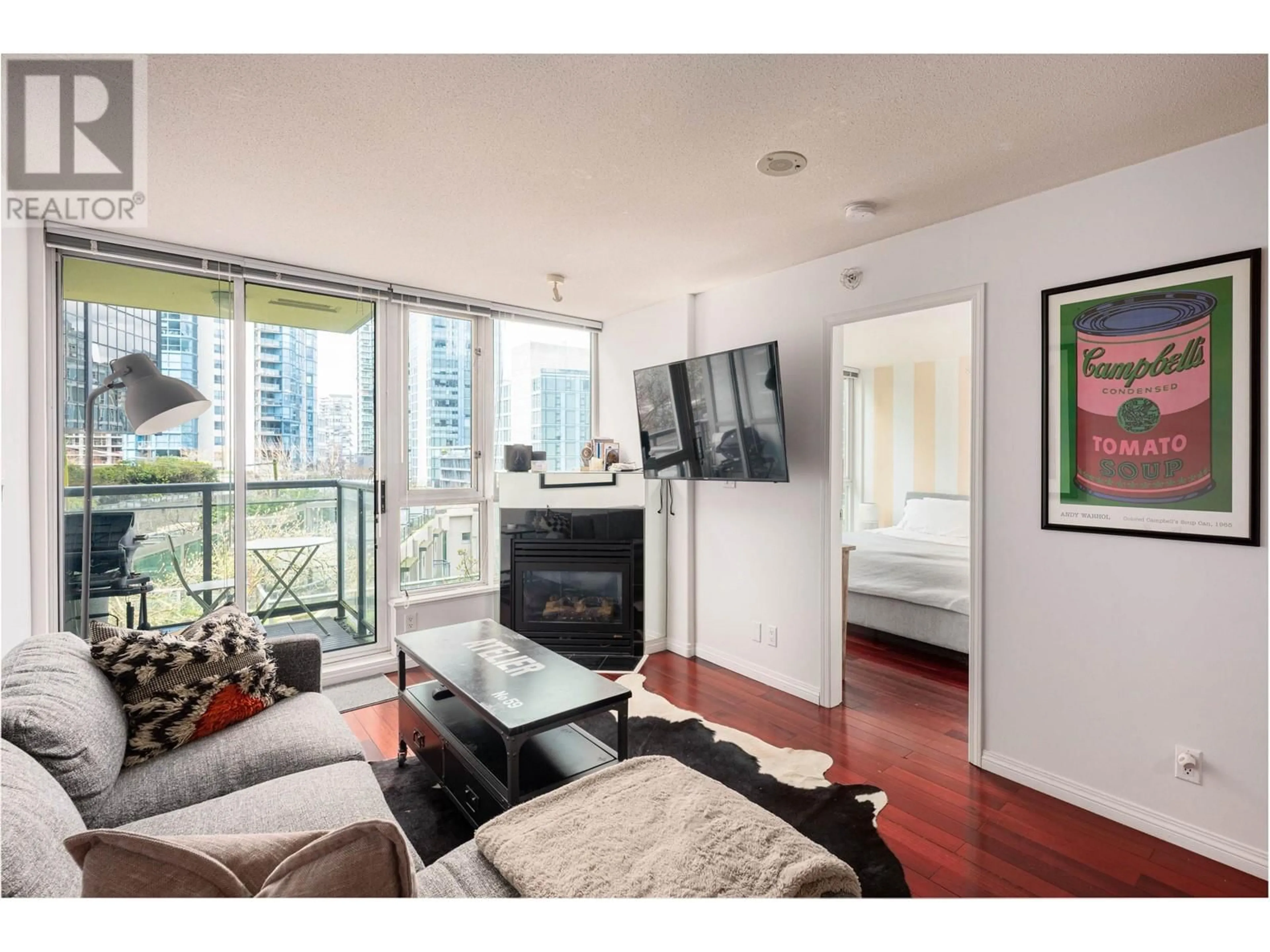 Living room with furniture, wood/laminate floor for 604 - 1328 PENDER STREET, Vancouver British Columbia V6E4T1