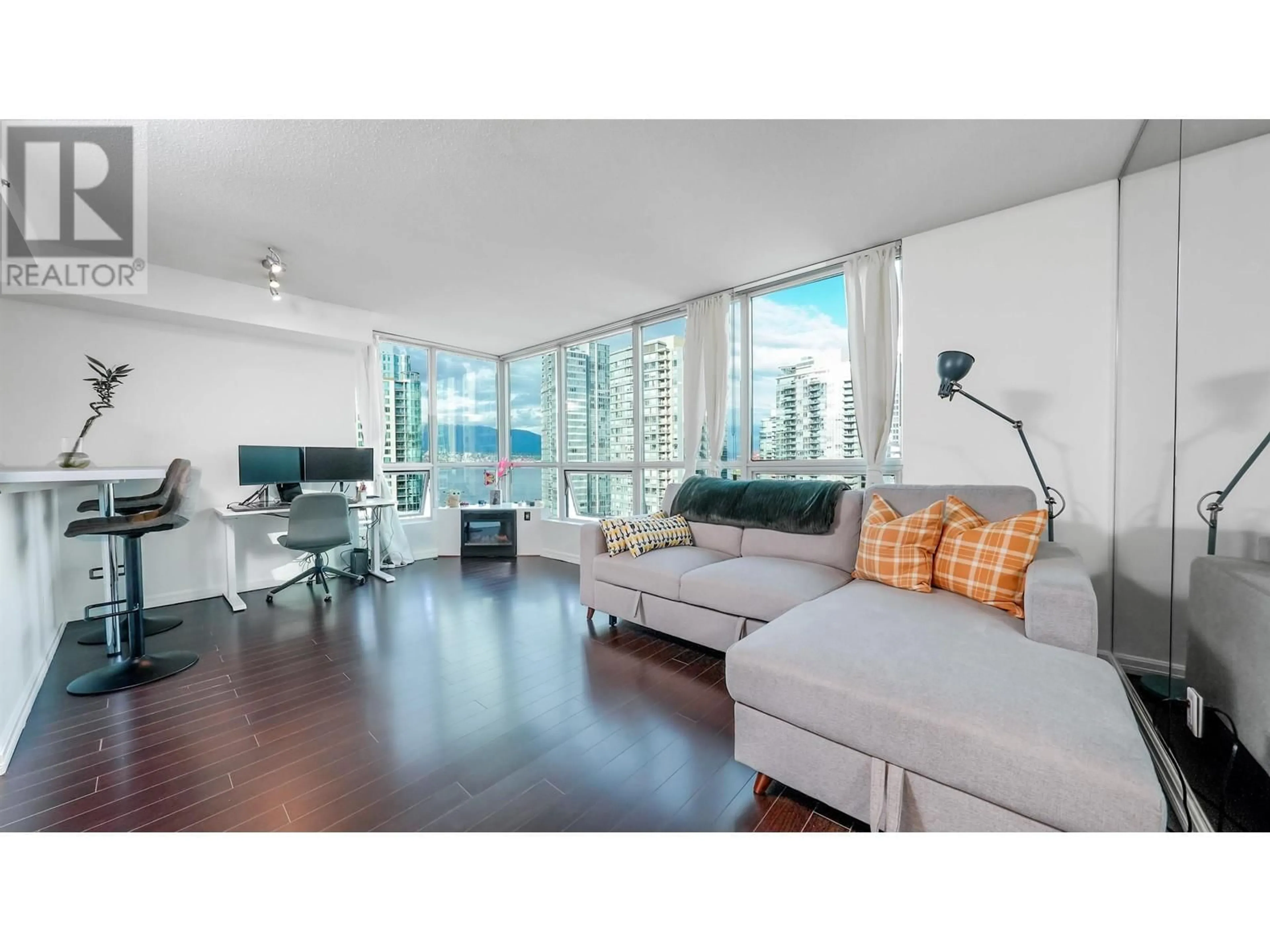 Living room with furniture, wood/laminate floor for 1704 - 555 JERVIS STREET, Vancouver British Columbia V6E4N1