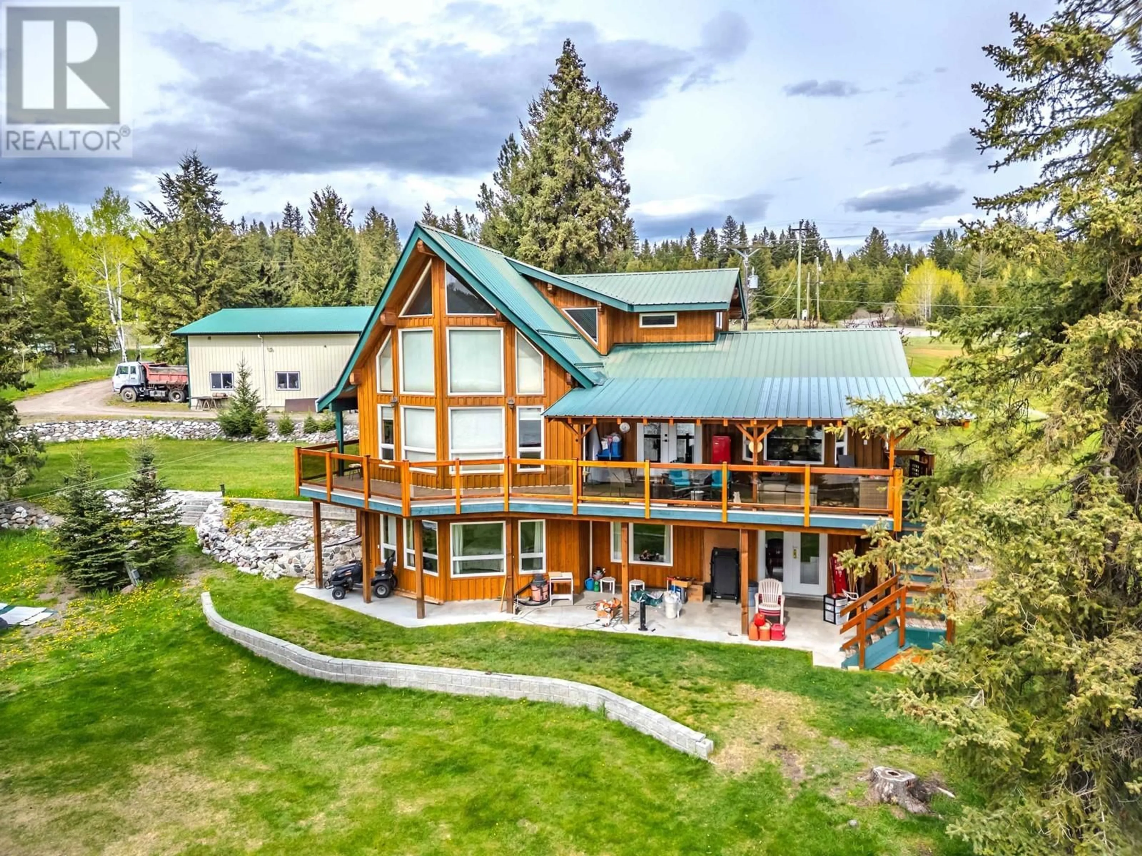 A pic from outside/outdoor area/front of a property/back of a property/a pic from drone, mountain view for 3544 CABIN ROAD, Lac La Hache British Columbia V0K1T1